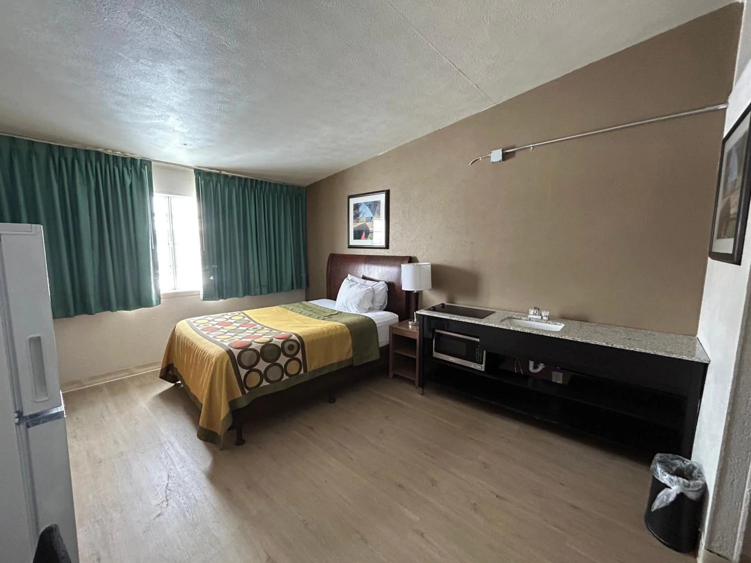 Kitchen or kitchenette, Bed in Studio Apartments