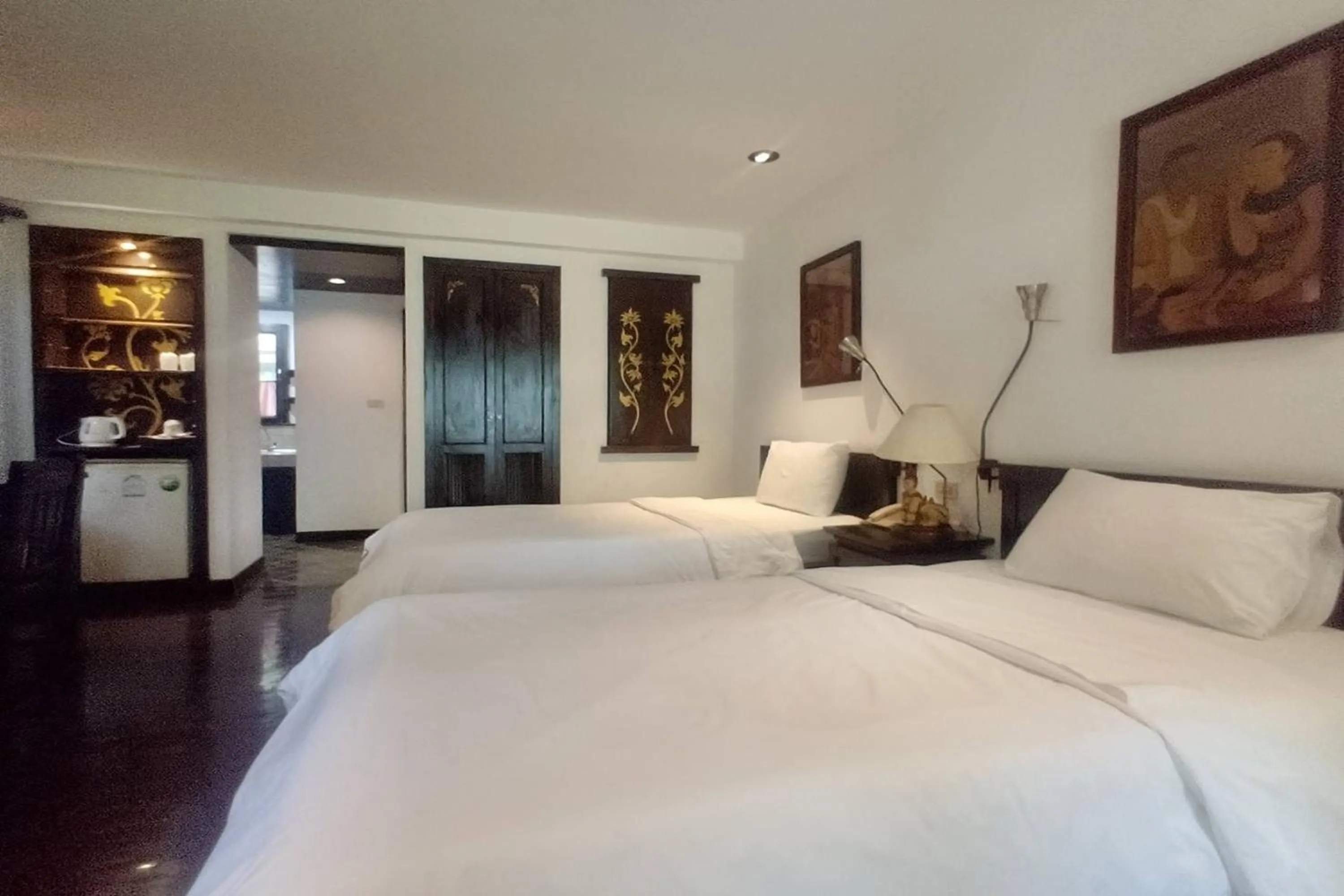 Bed in Baan Orawee Boutique Hotel