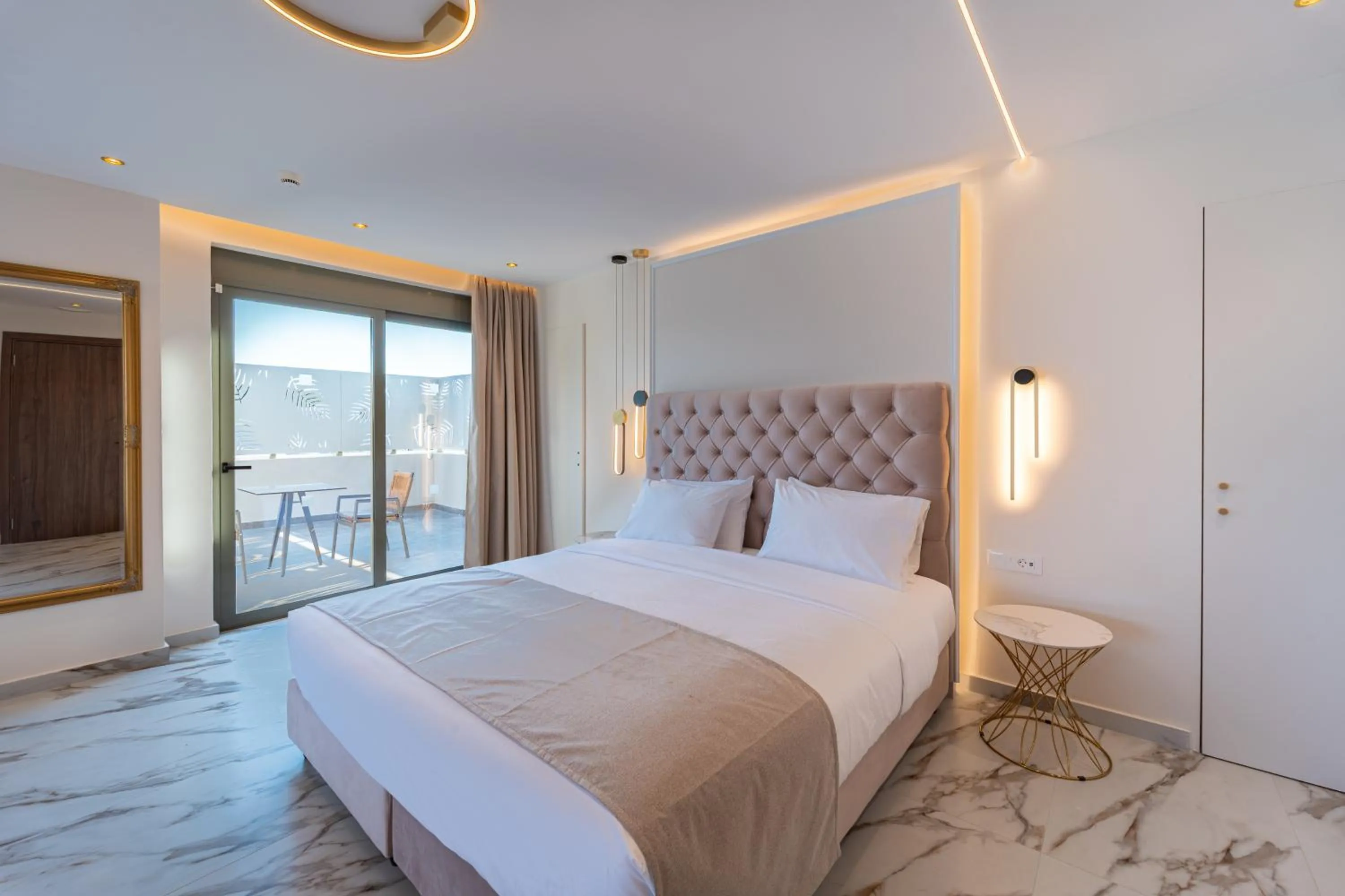 Bed in Philia Center Suites