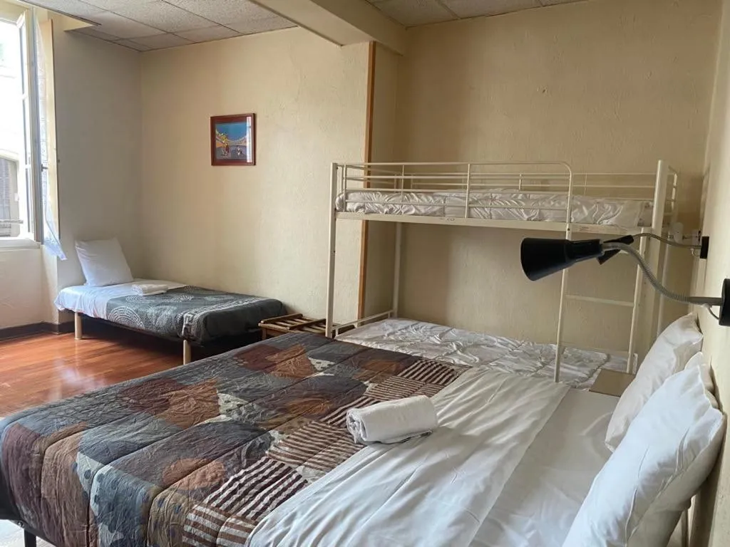 Bed in Hotel Du Commerce