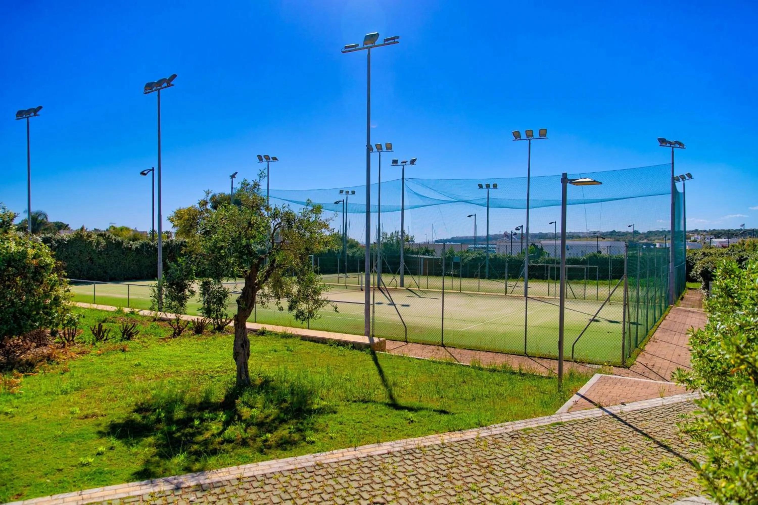 Tennis court in Cala Ponte, a Tribute Portfolio Hotel