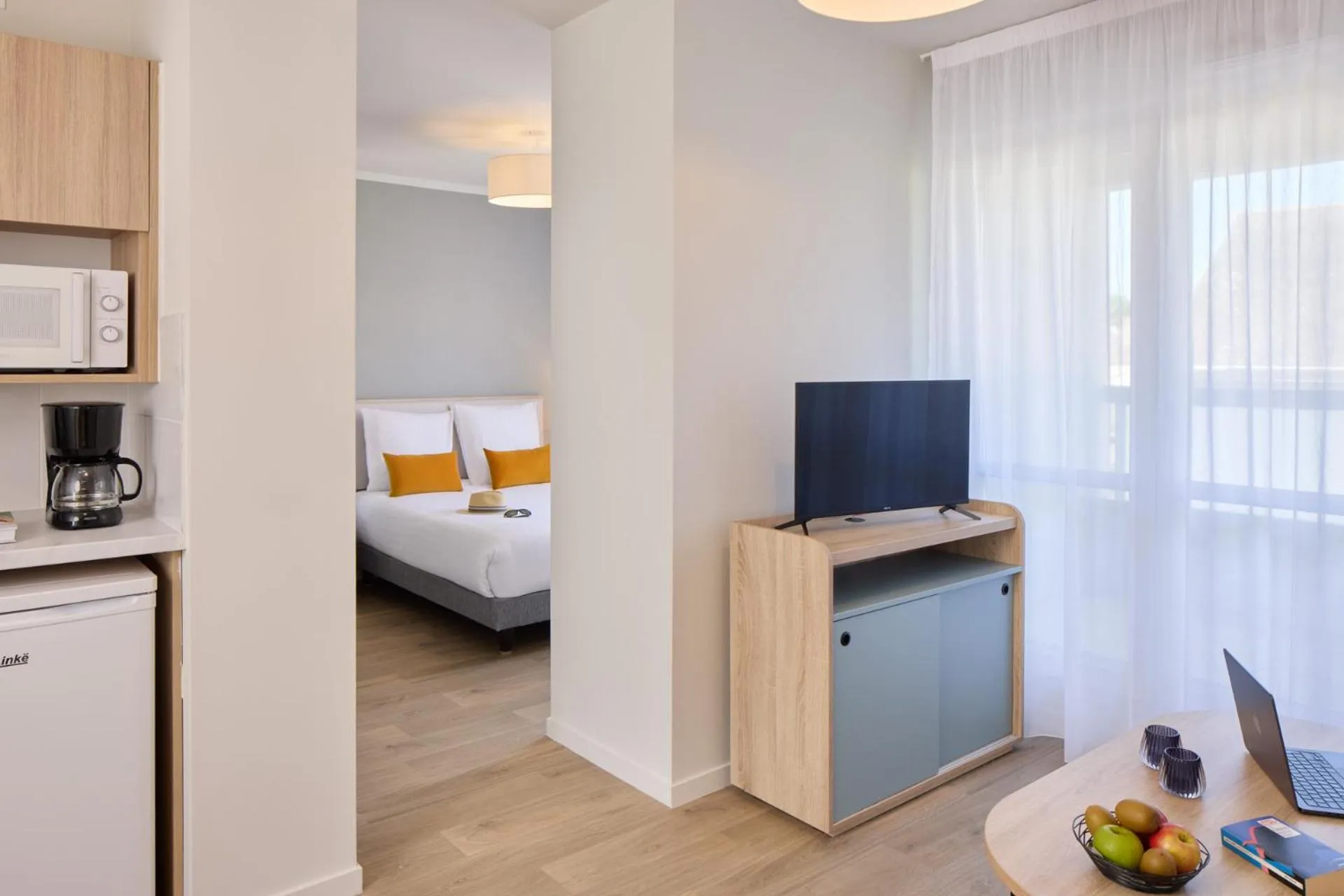 Kitchen or kitchenette, Bed in Quality Aparthotel Saumur