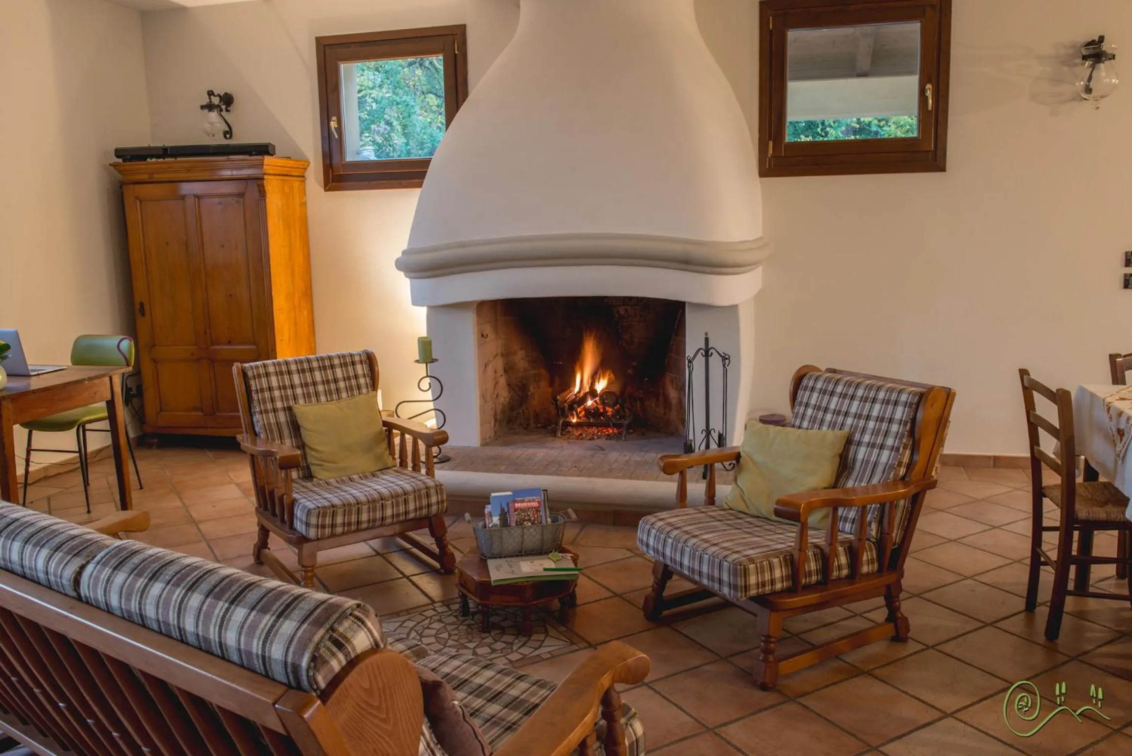 Communal lounge/ TV room in Locanda Camera con Vista