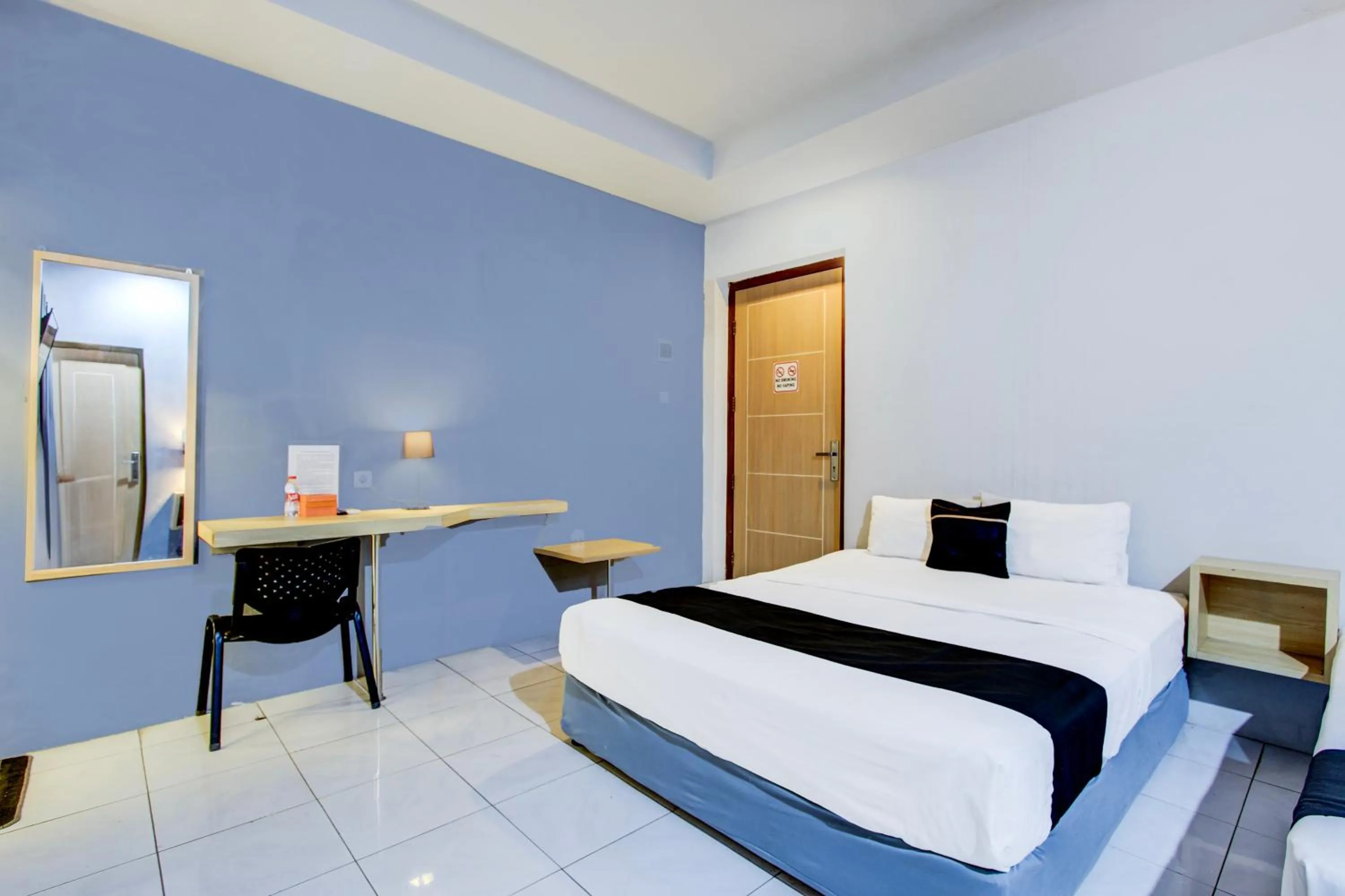 Photo of the whole room, Bed in Hotel O Tegal near near Pacific Mall Tegal formerly Hugo Suites Family