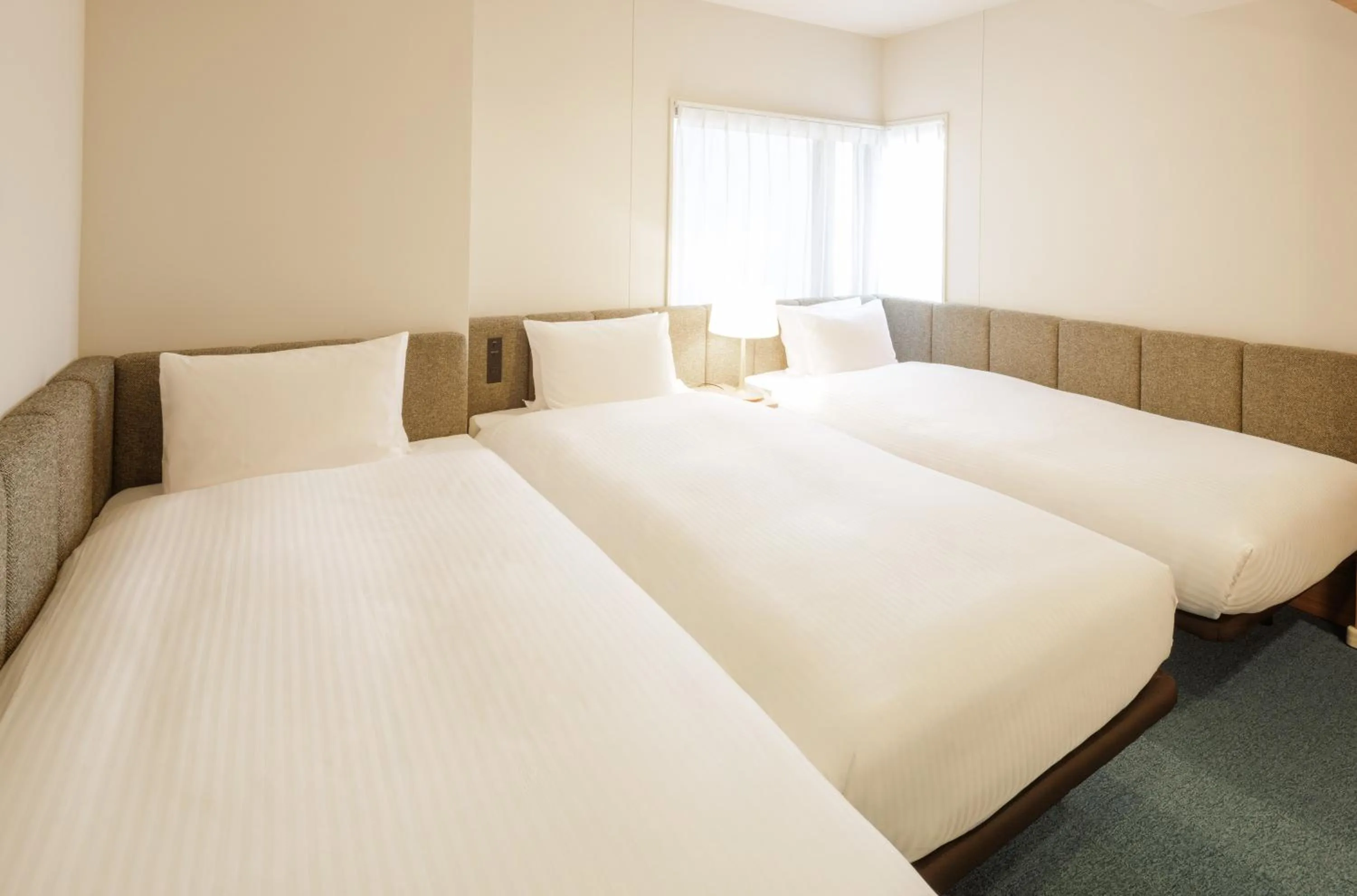 Bed in HOTEL AMANEK Asakusa Sakurabashi