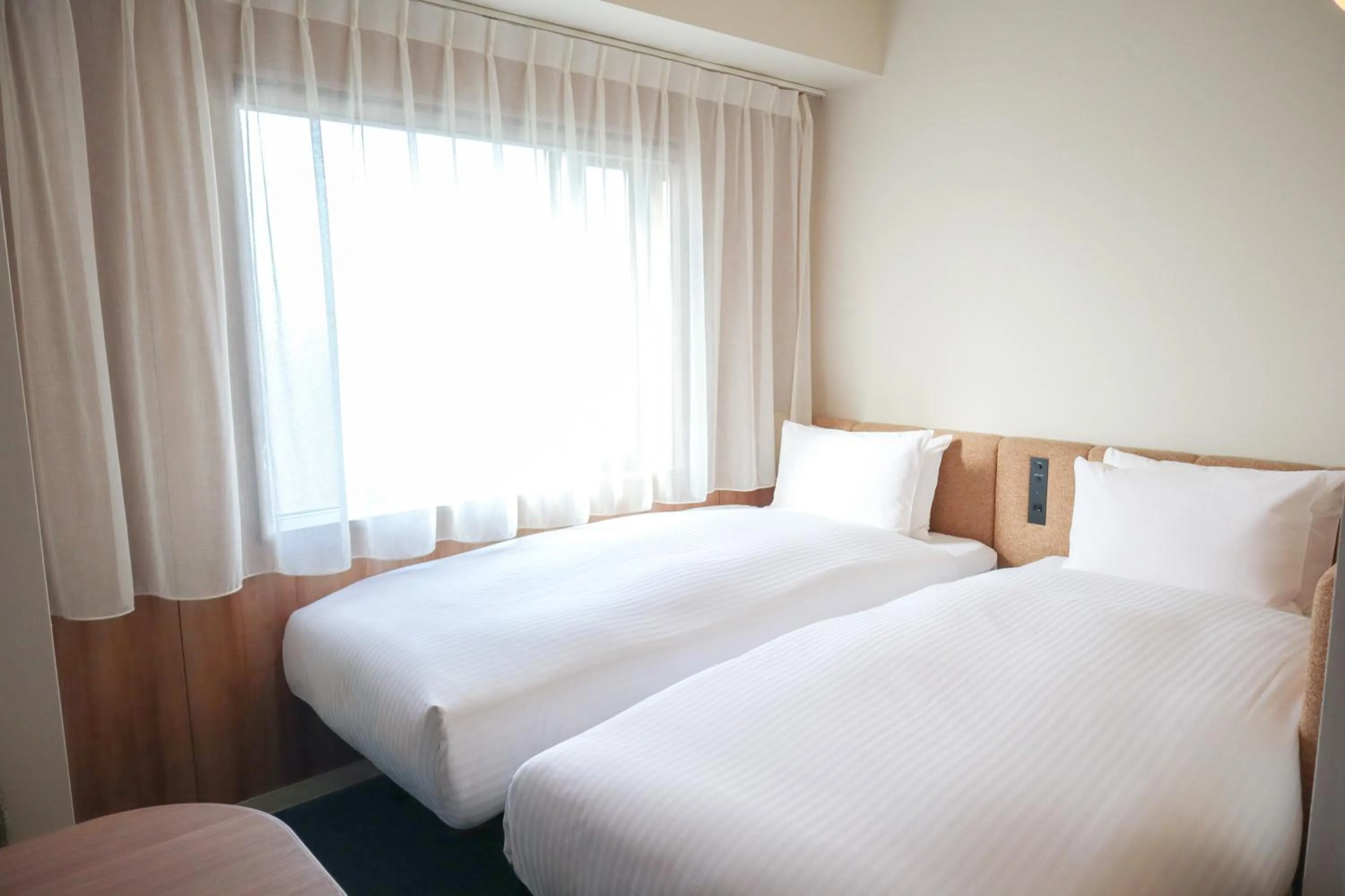 Bed in HOTEL AMANEK Asakusa Sakurabashi