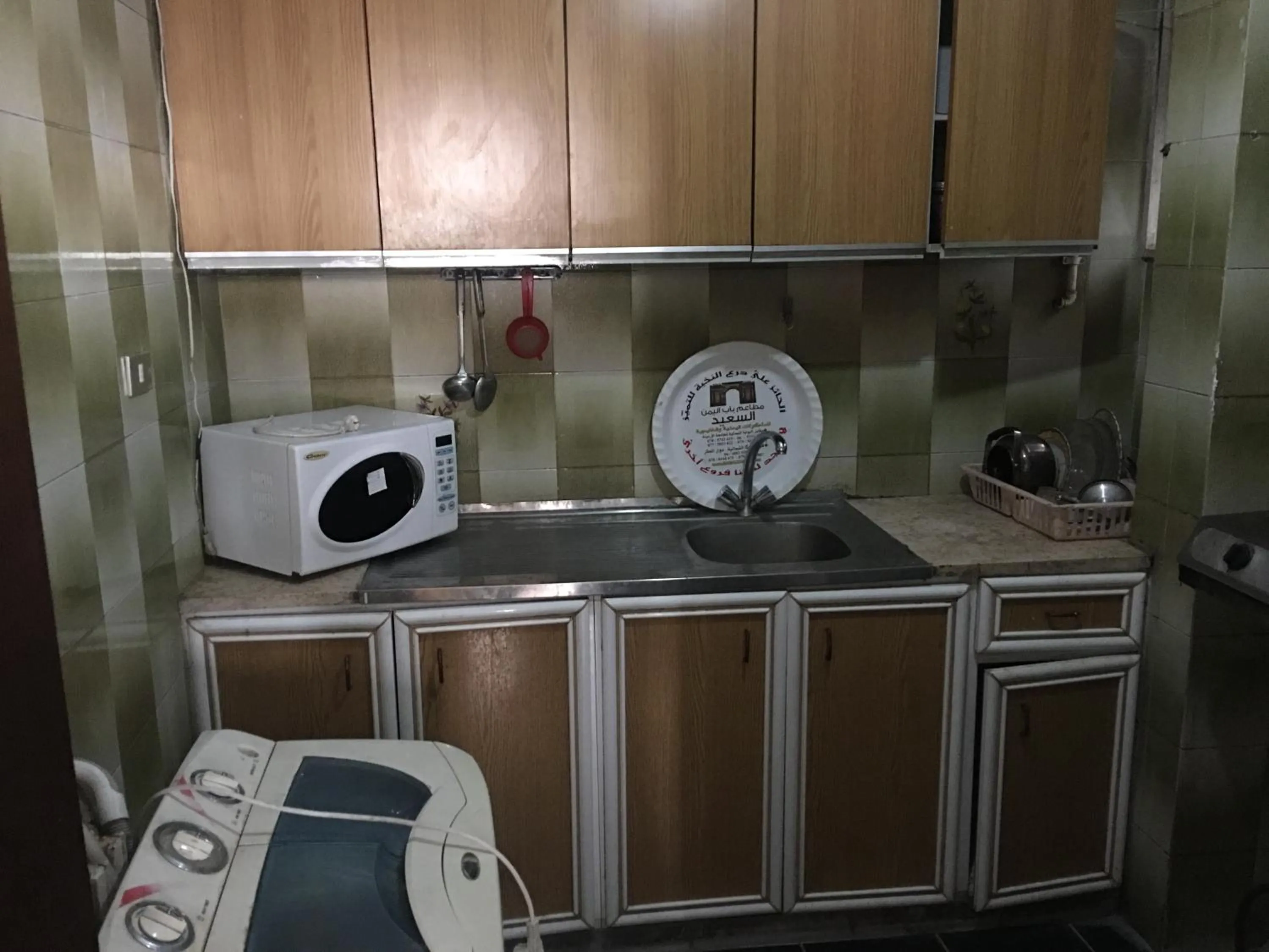 Kitchen or kitchenette in Aljazeera Hotel Apartments