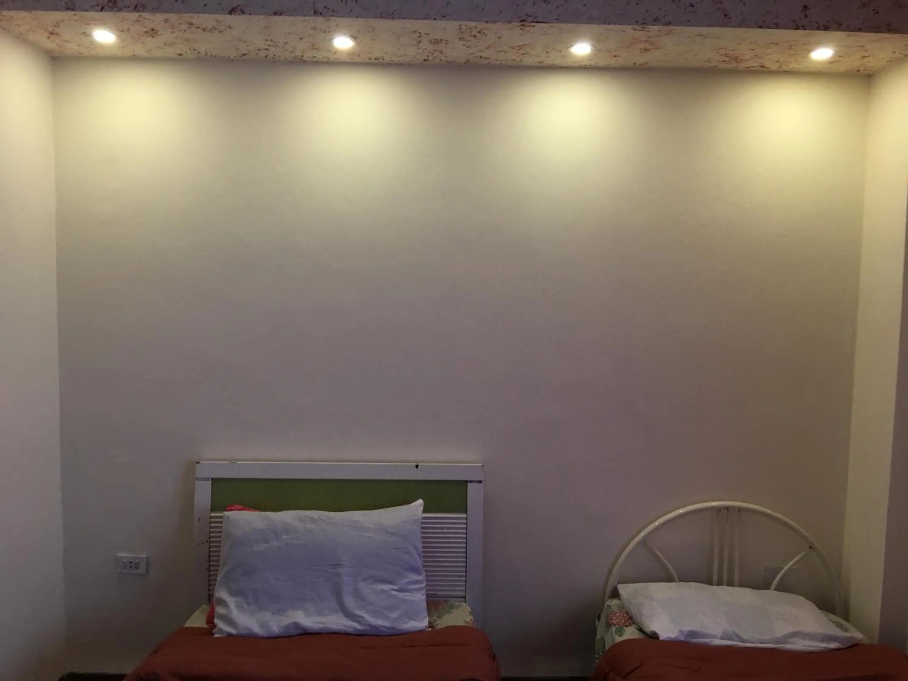 Bed in Aljazeera Hotel Apartments