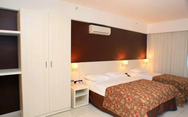 Bed in Pousada do Ipê