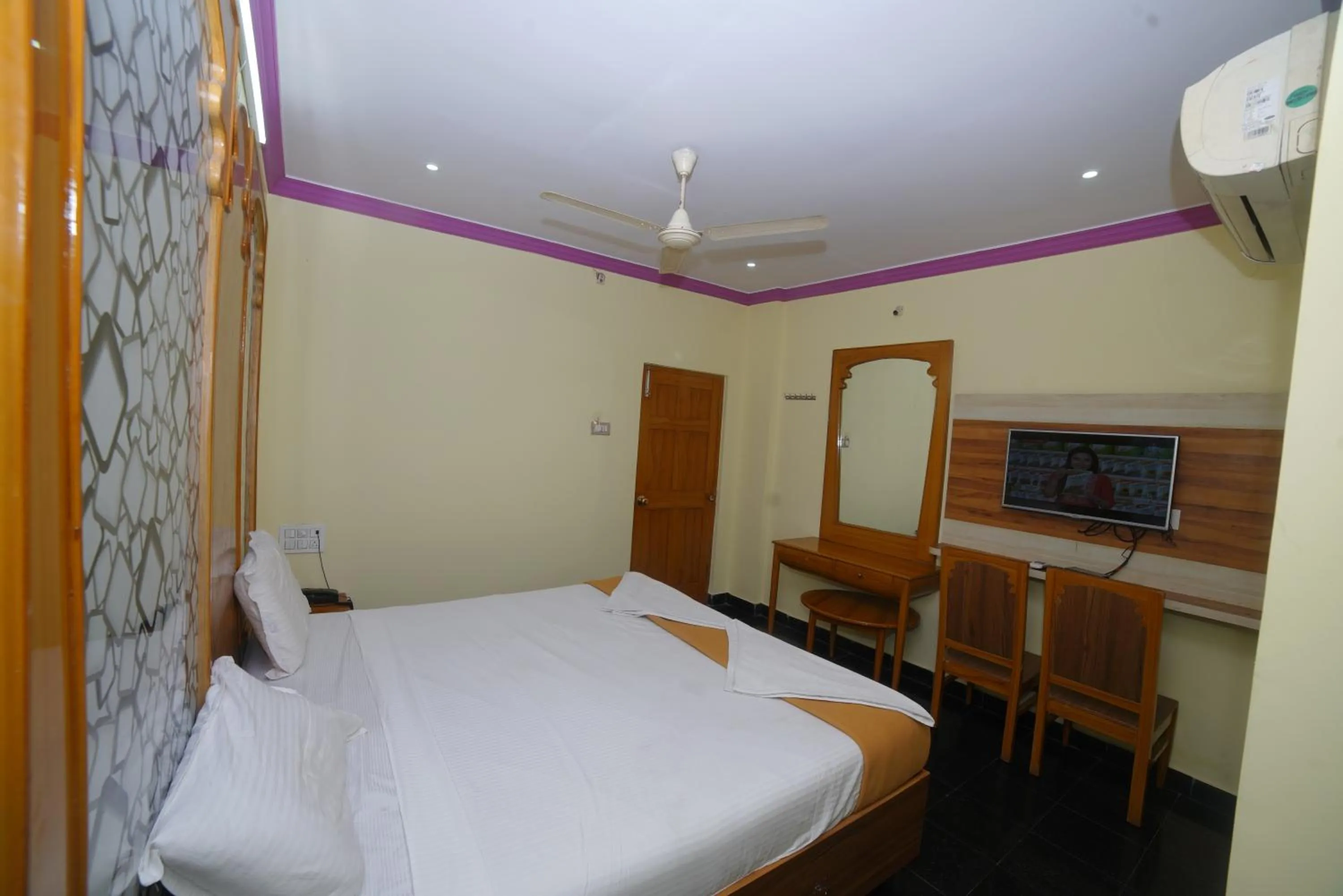 air conditioner, Bed in HOTEL ASWINi GRAND LODGE