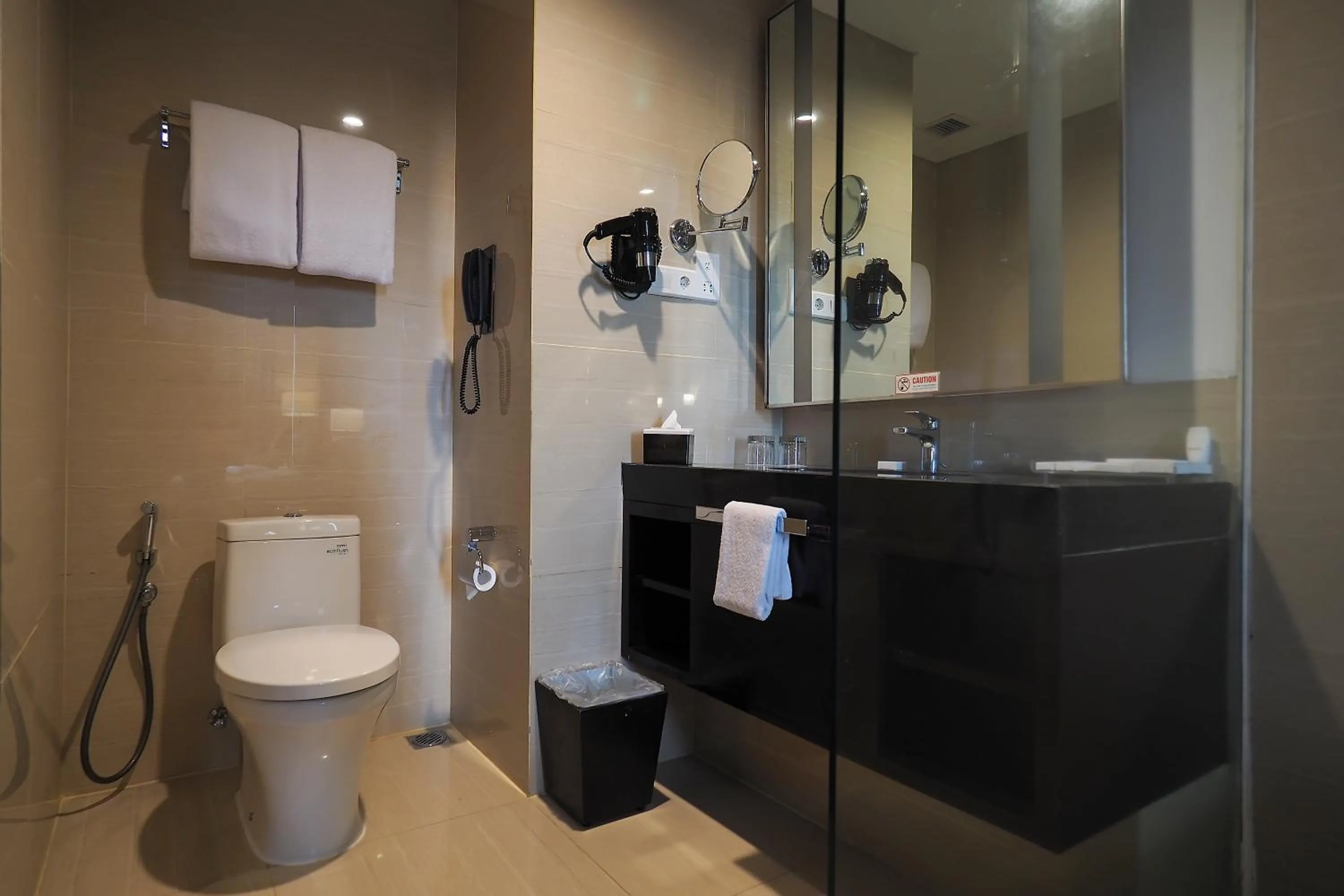 Bathroom in Grand Mercure Solo Baru