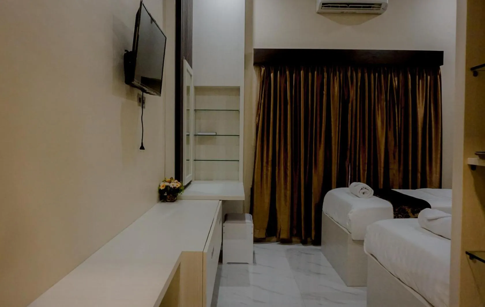 Bed in Garuda Hotel By Calandra