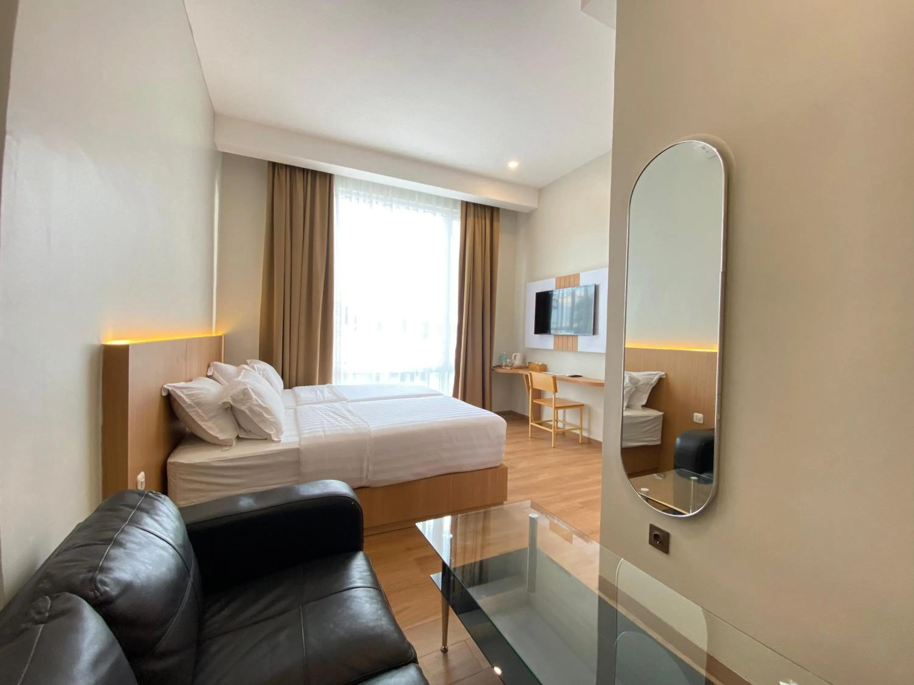 Bed in Garuda Hotel By Calandra