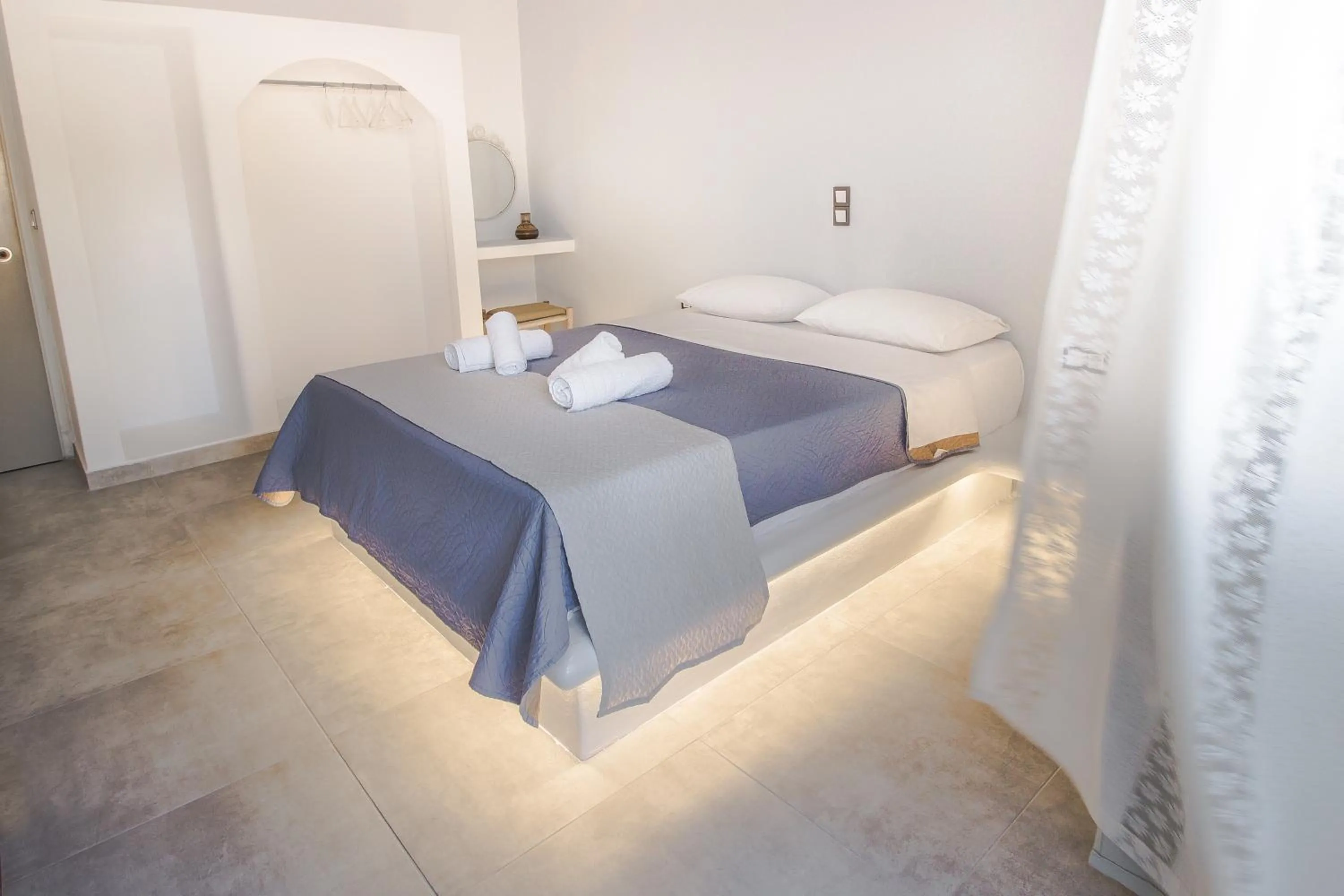 Bedroom, Bed in Blue Era Apartments