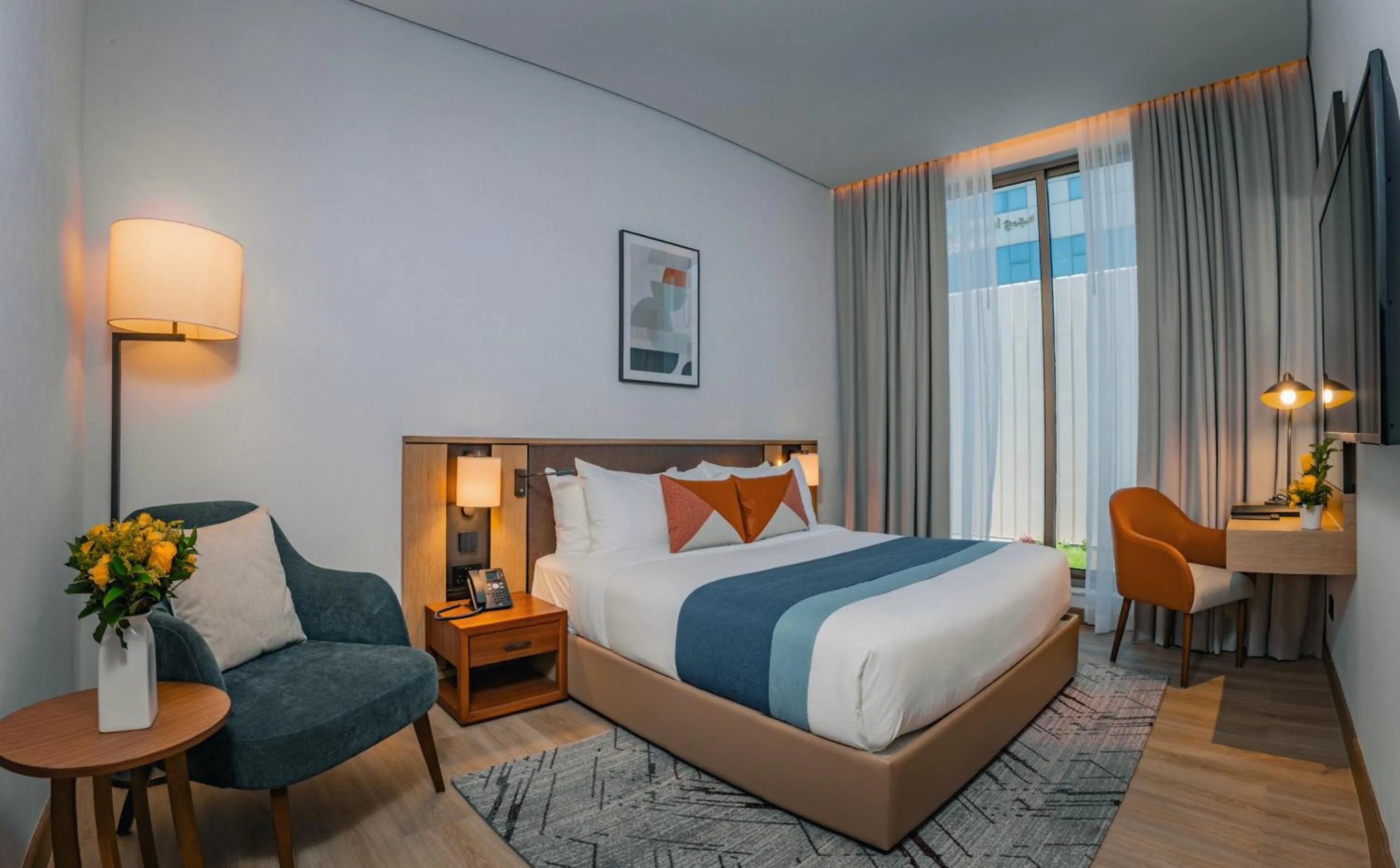 Bed in First Grand Hotel