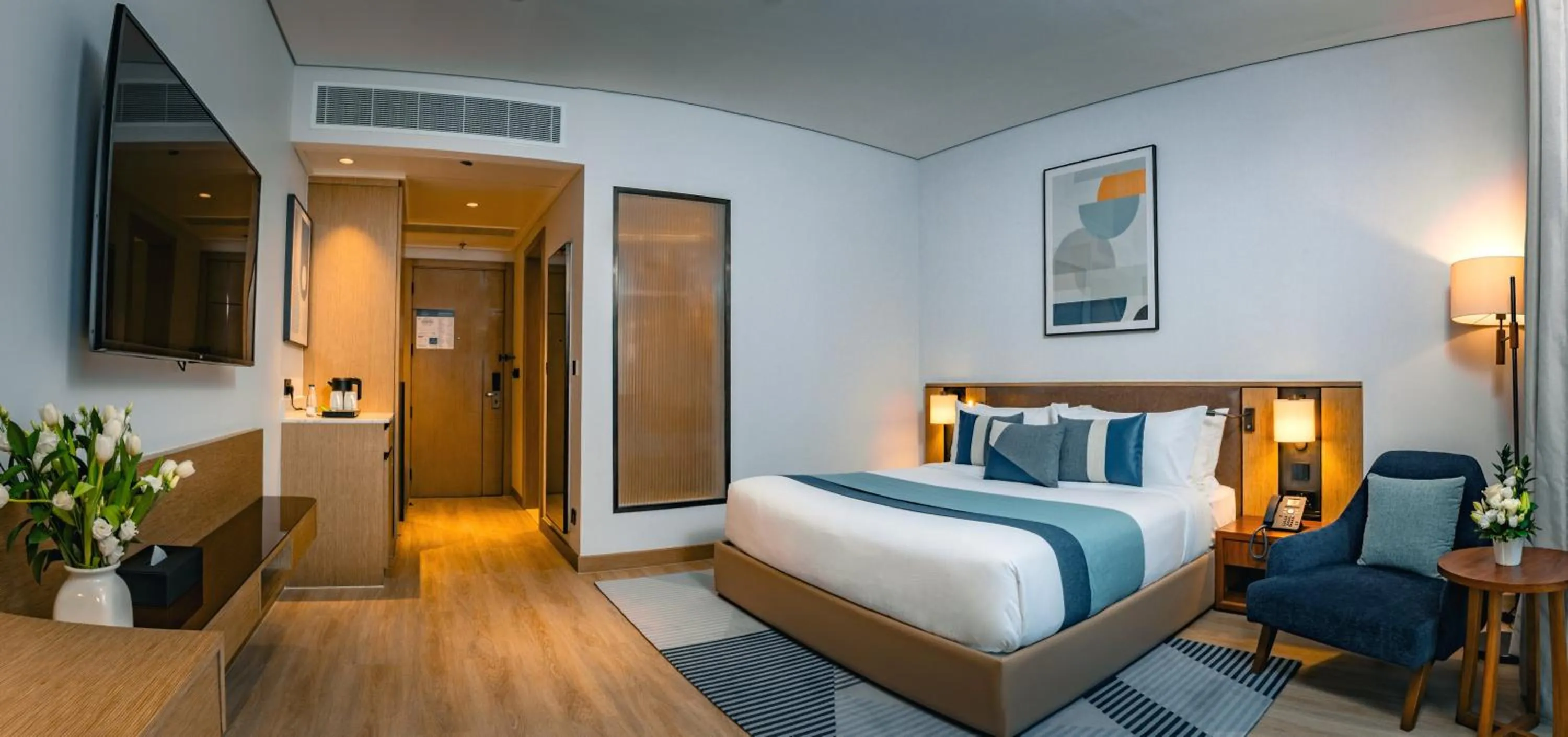 Bed in First Grand Hotel