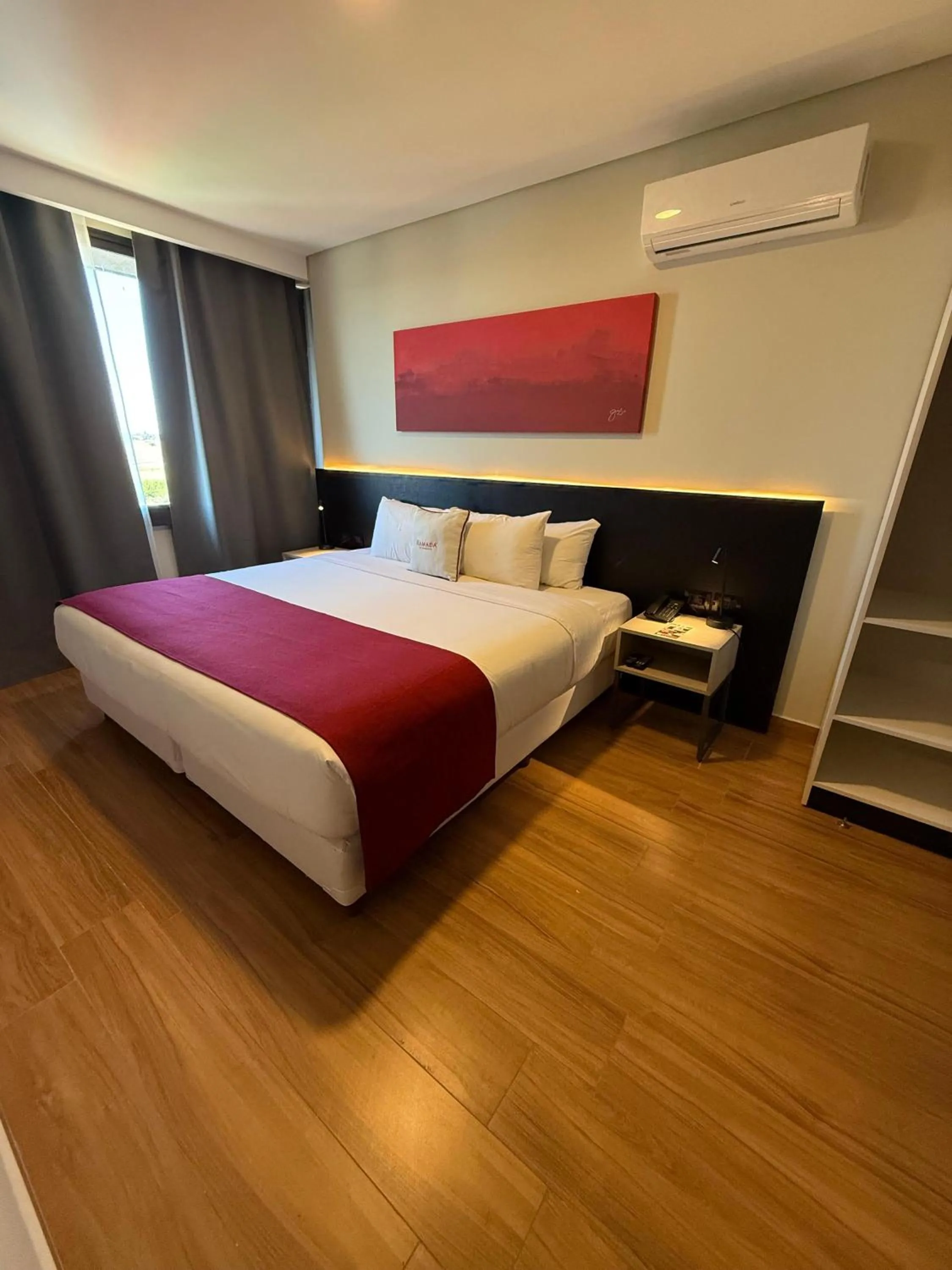 Bed in Ramada Suites by Wyndham Asuncion Aeropuerto