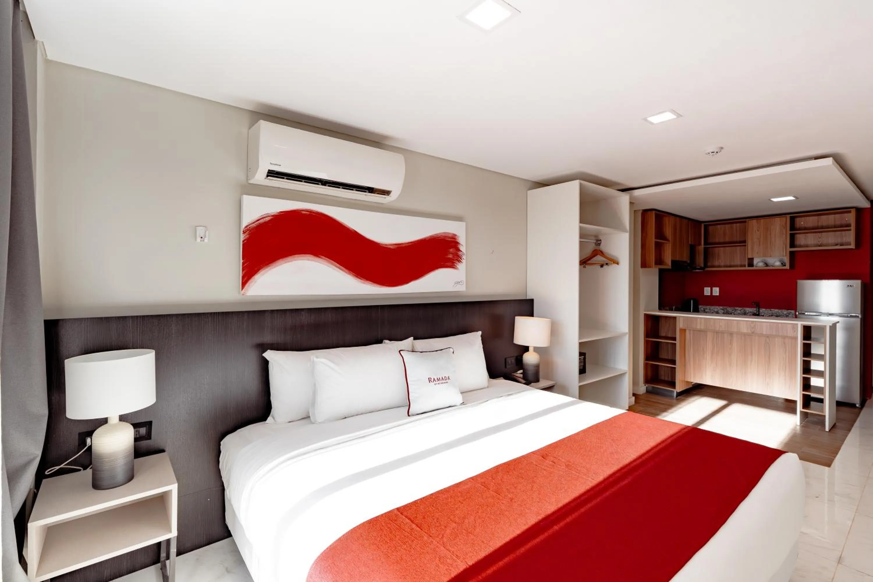 Bed in Ramada Suites by Wyndham Asuncion Aeropuerto