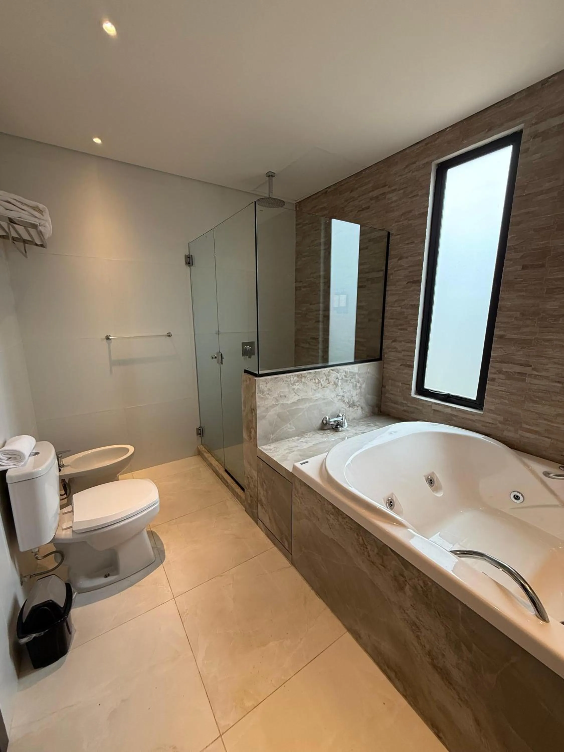 Bathroom, Bed in Ramada Suites by Wyndham Asuncion Aeropuerto