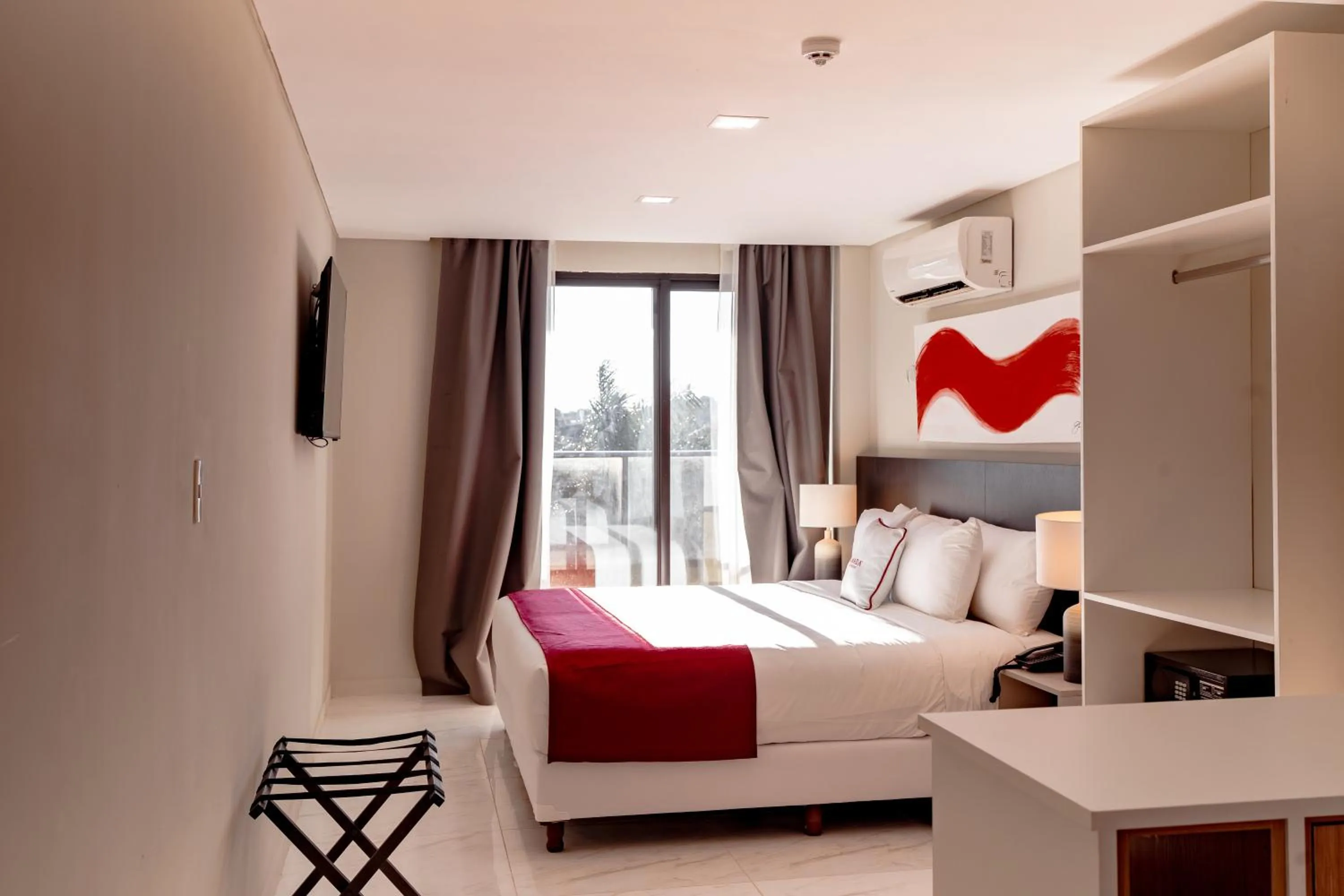 Bed in Ramada Suites by Wyndham Asuncion Aeropuerto