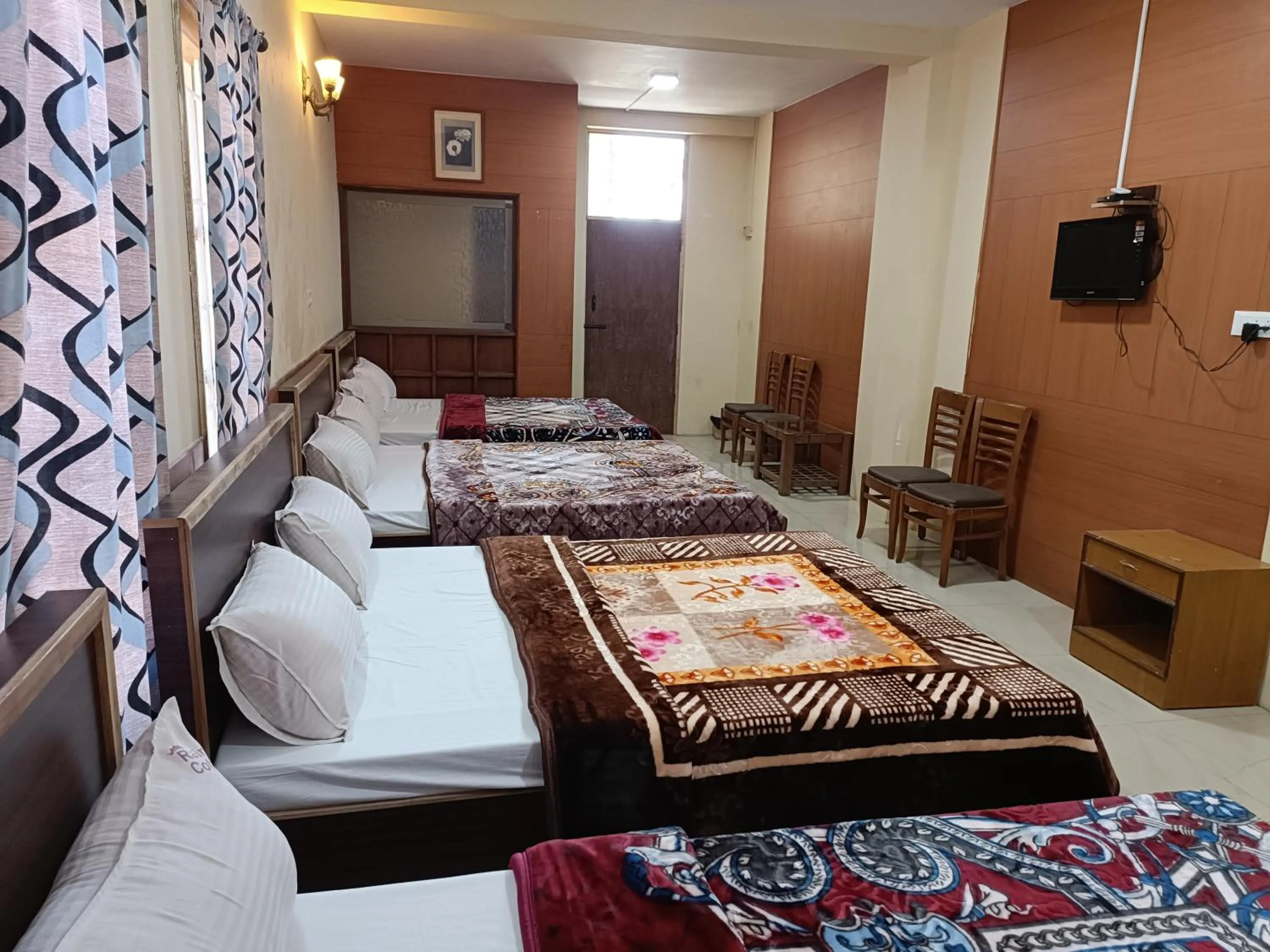 Bed in Rainbow Cottages-Budget Friendly rooms