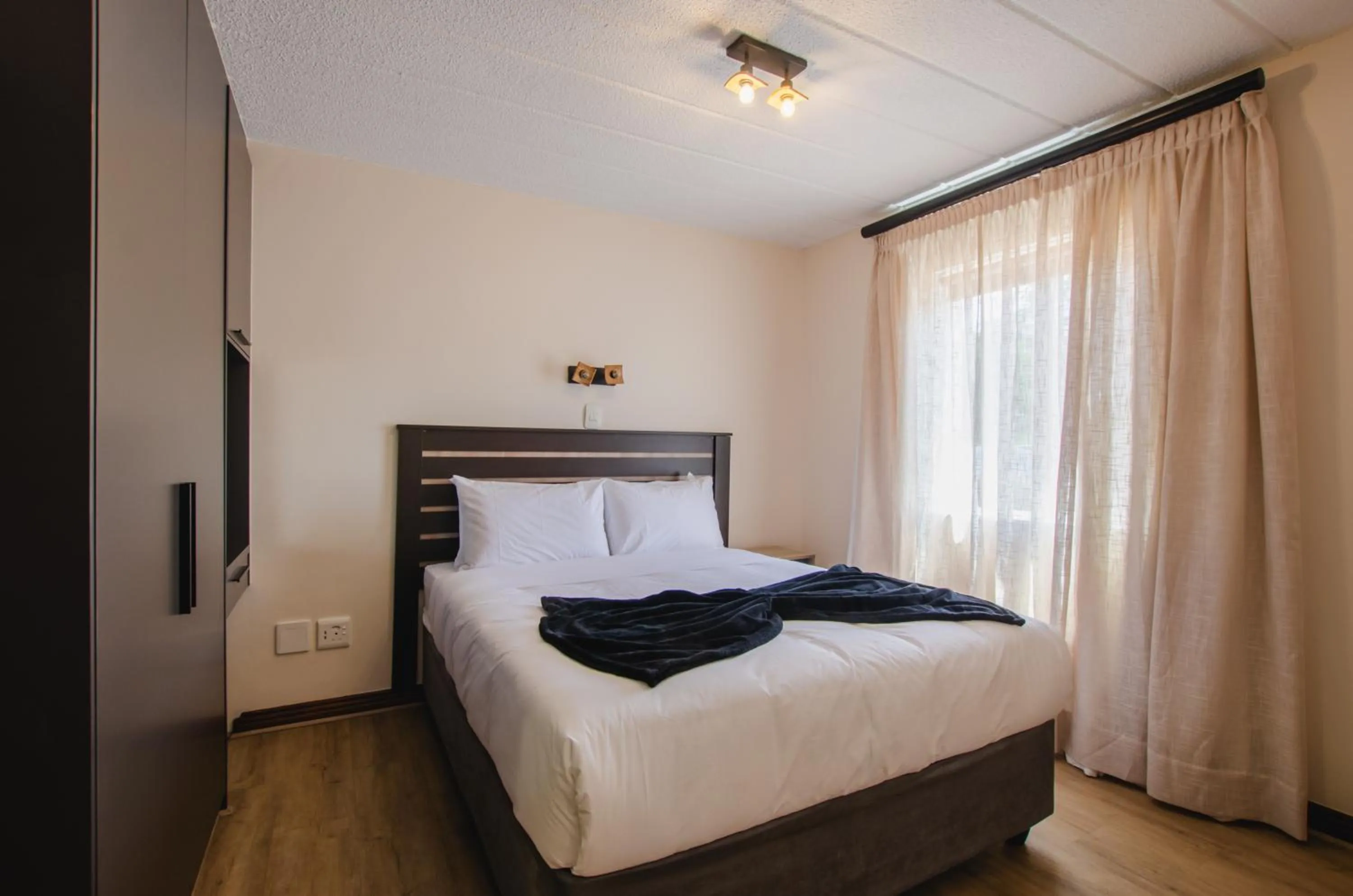 Bed in Melrose Corner Self-Catering Hotel Apartments