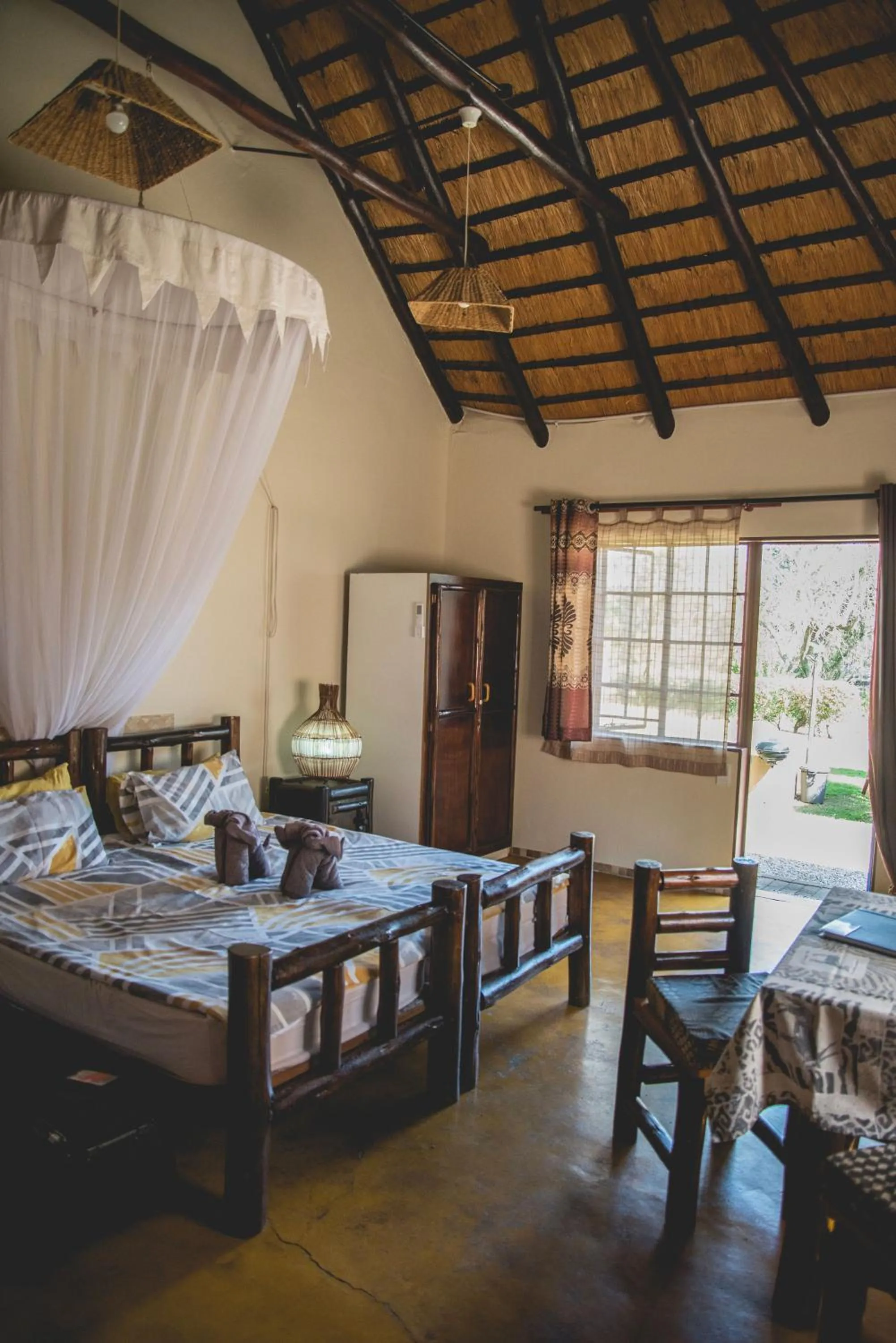 Photo of the whole room, Bed in Thokozani Lodge