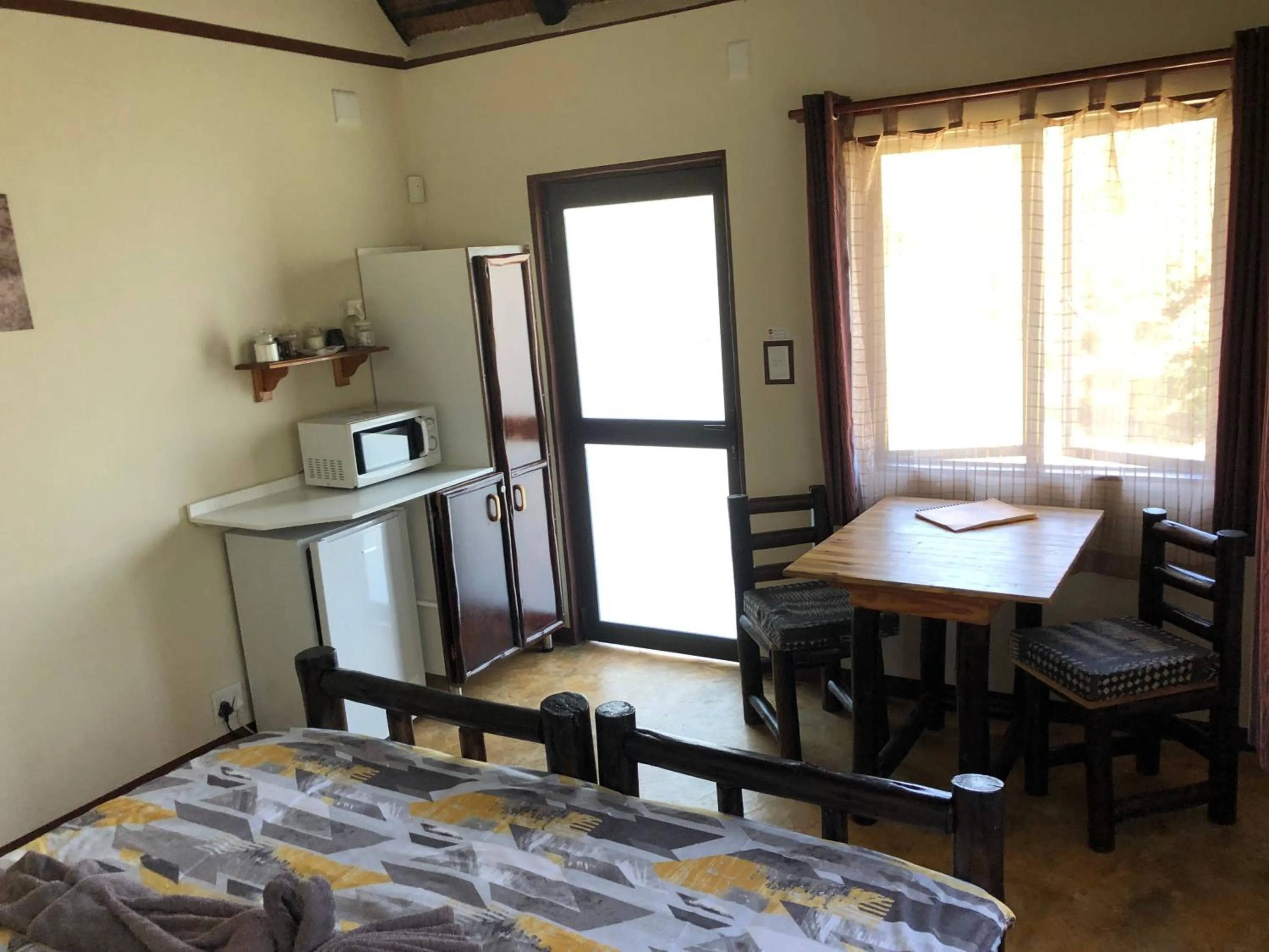 Photo of the whole room, Bed in Thokozani Lodge