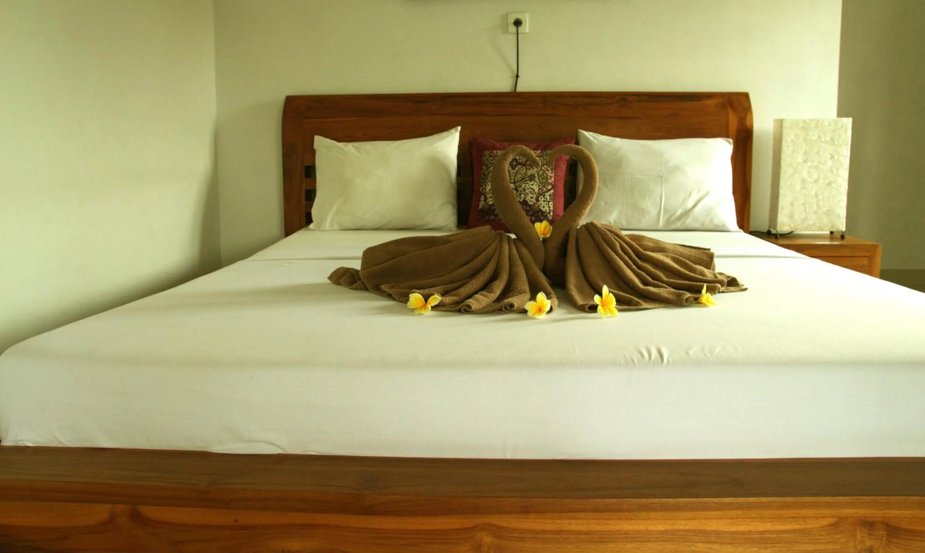 Bed in Suryadina Guest House