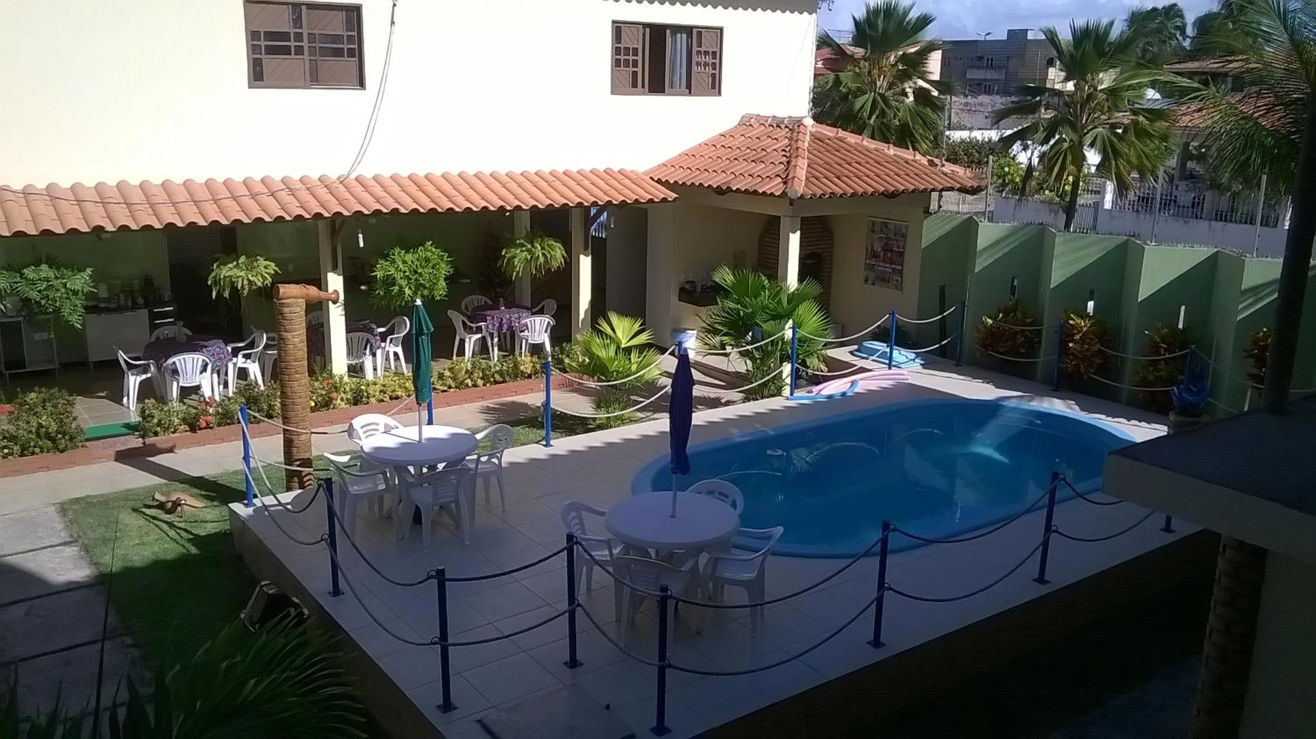 Swimming pool in Pousada Paraíso das Palmeiras