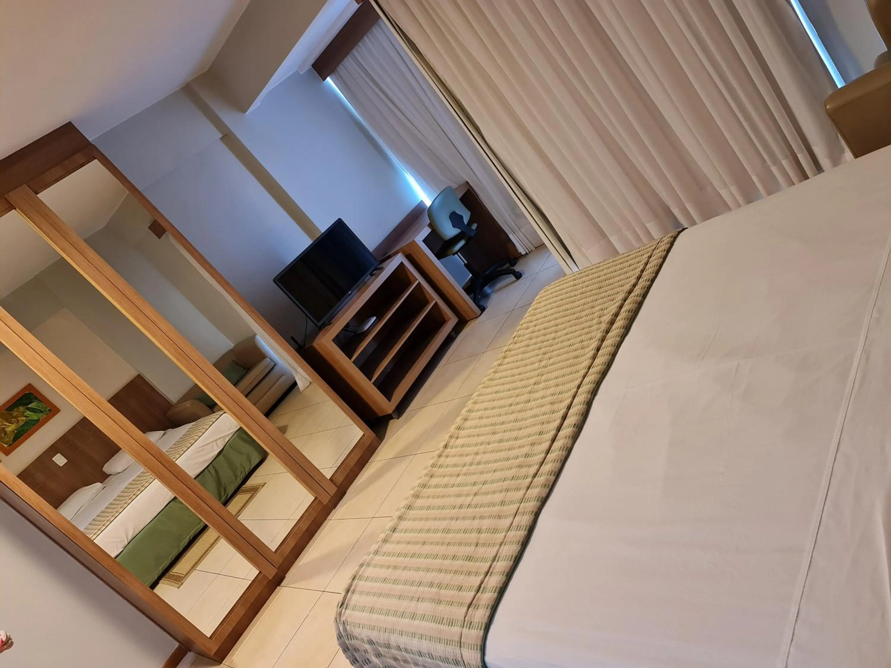 View (from property/room), Bed in Flat Brasília - Setor Hoteleiro Norte