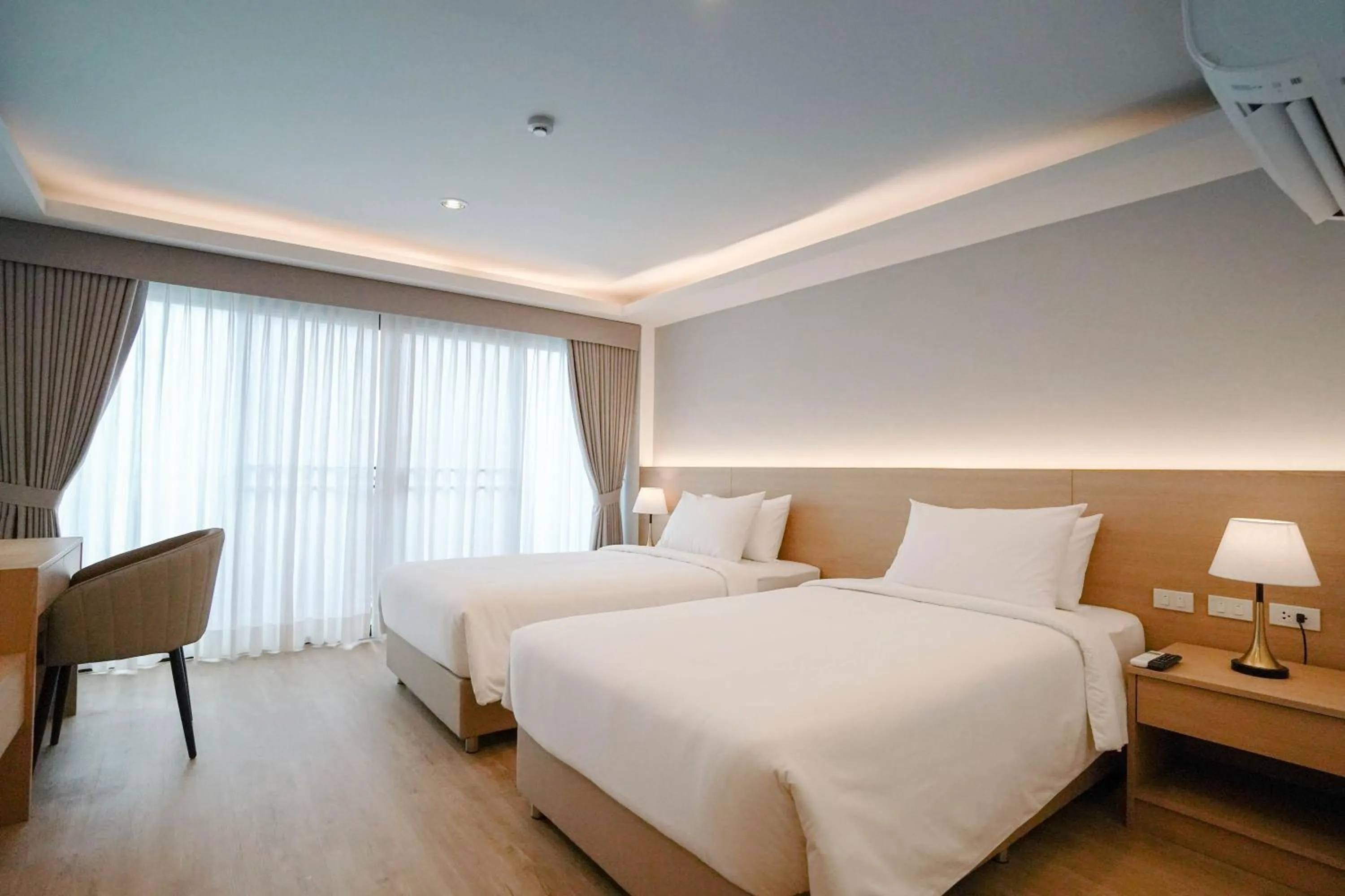 Bed in The Kite Hotel Bangsaen by Koko