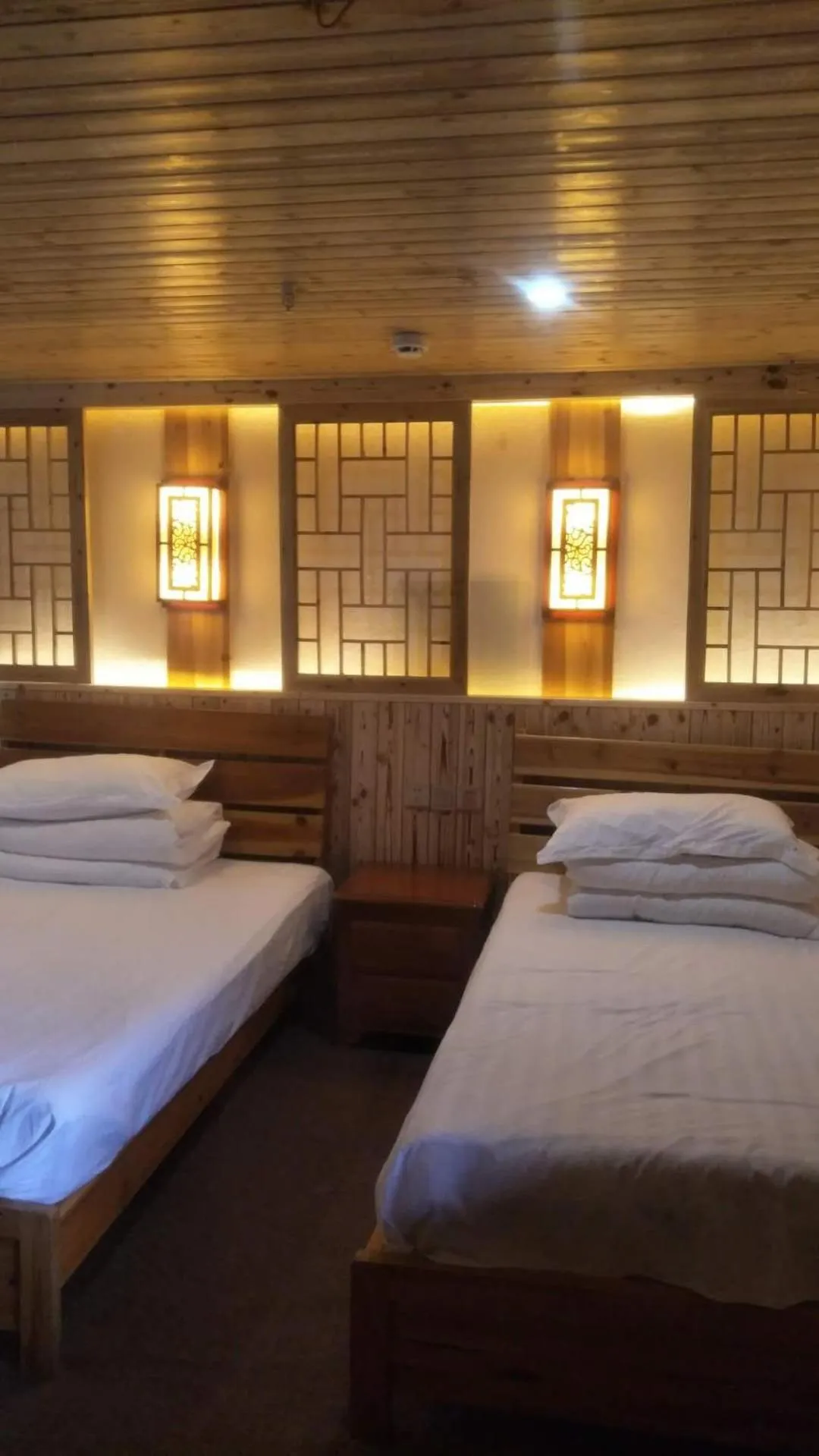 Bed in Nanjing Tulou Qingdelou Inn