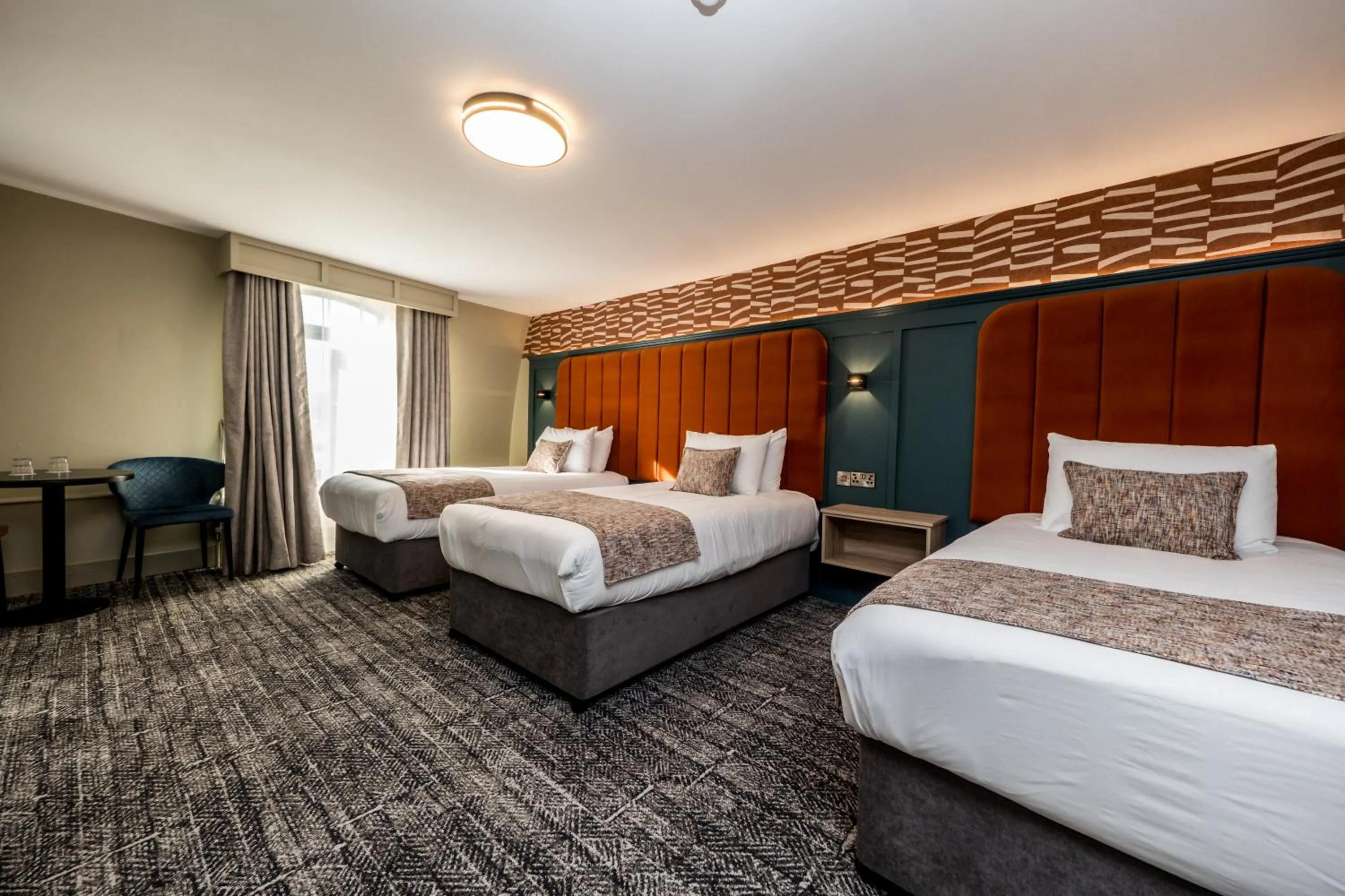 Bed in The Maiden City Hotel