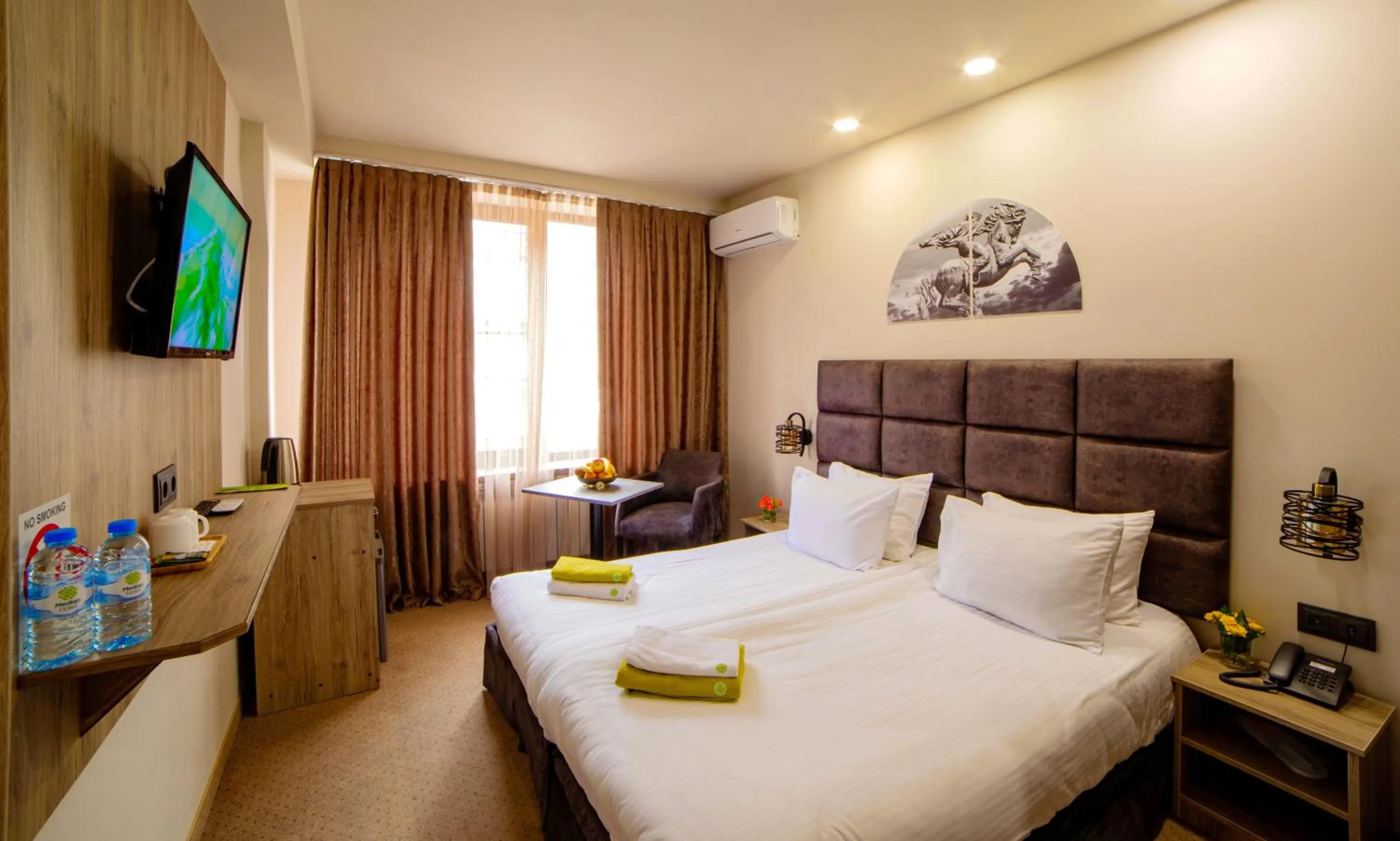 Bed in Elysium Gallery Hotel