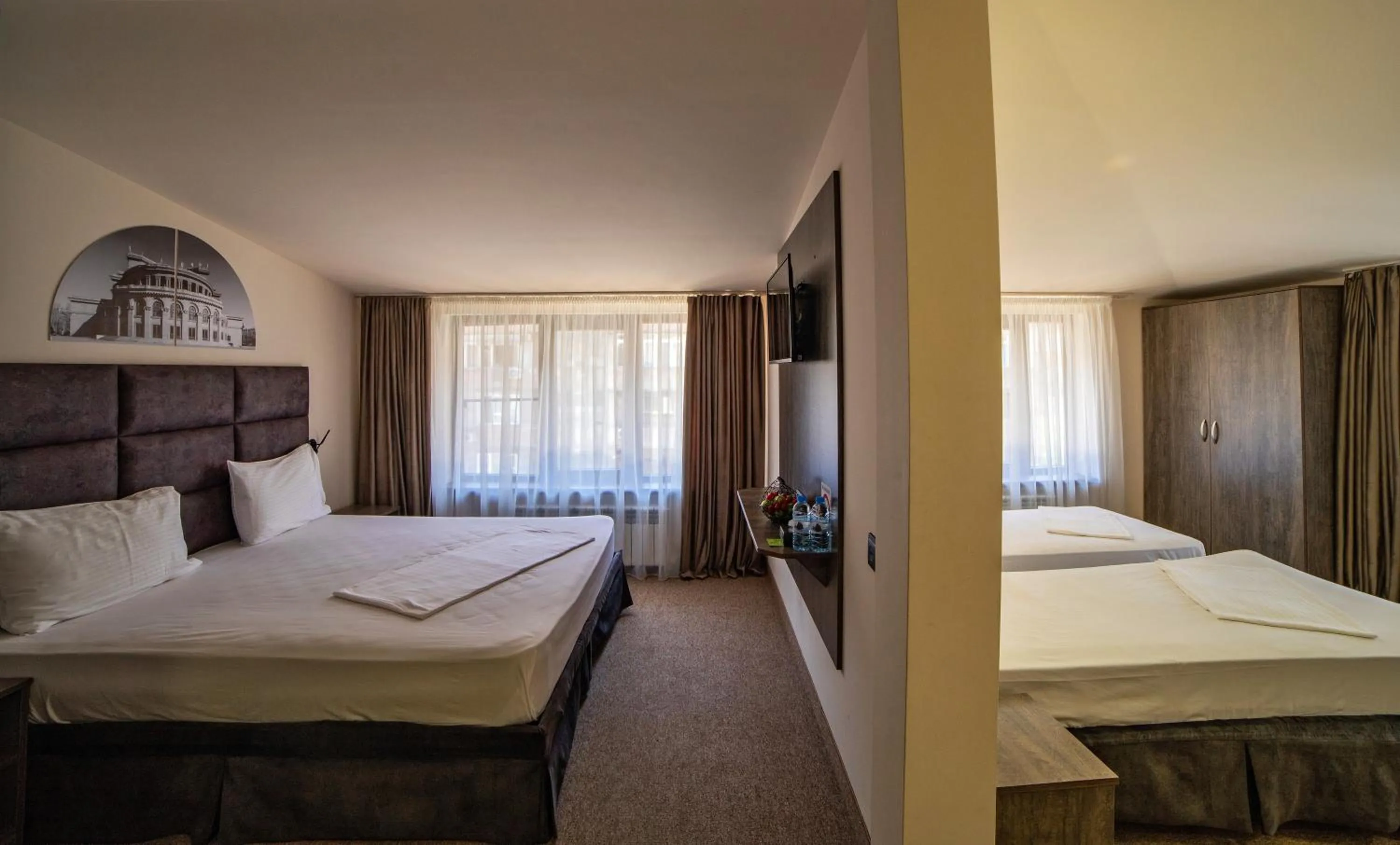 Bed in Elysium Gallery Hotel