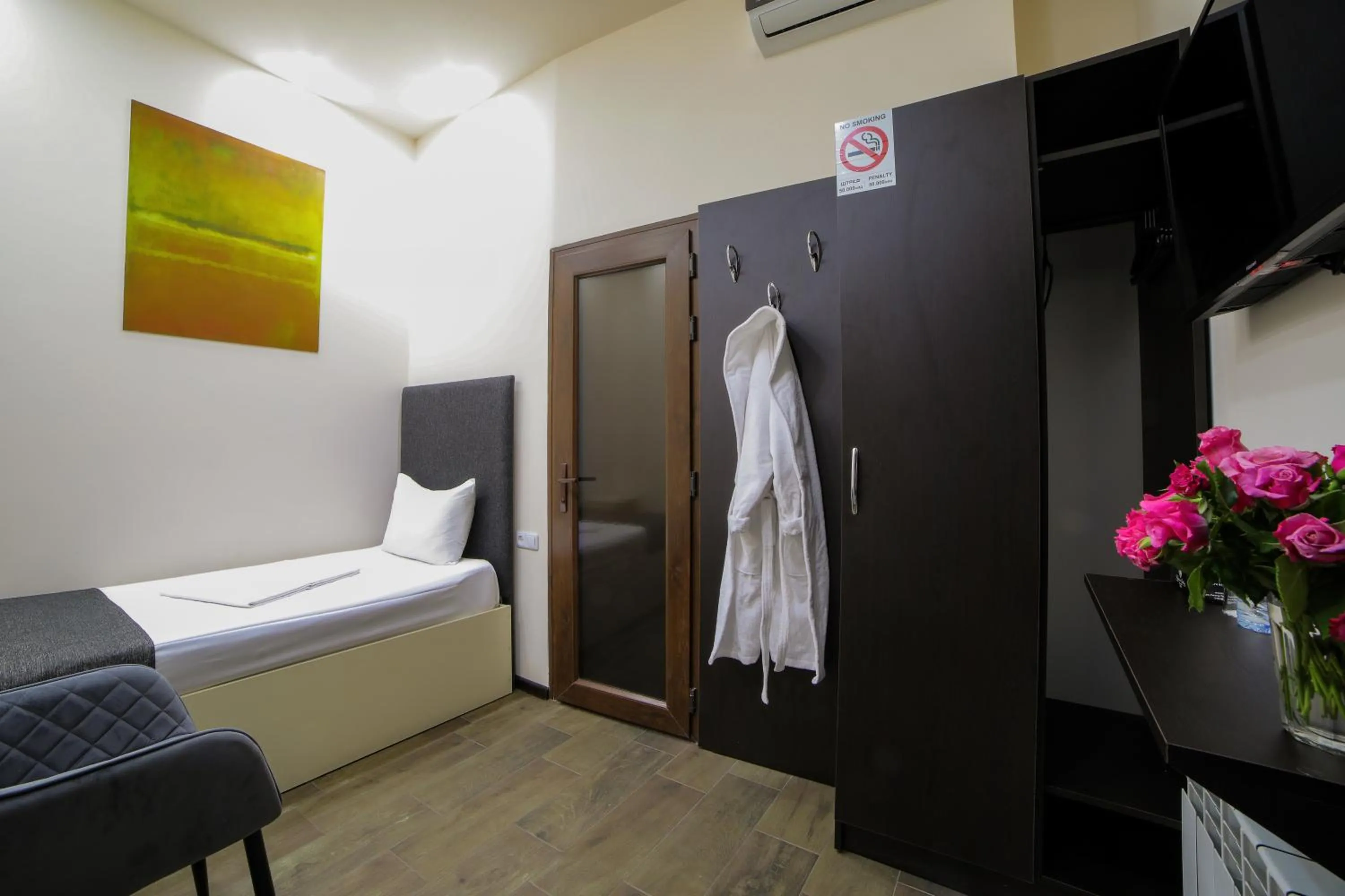 Bed in Elysium Gallery Hotel