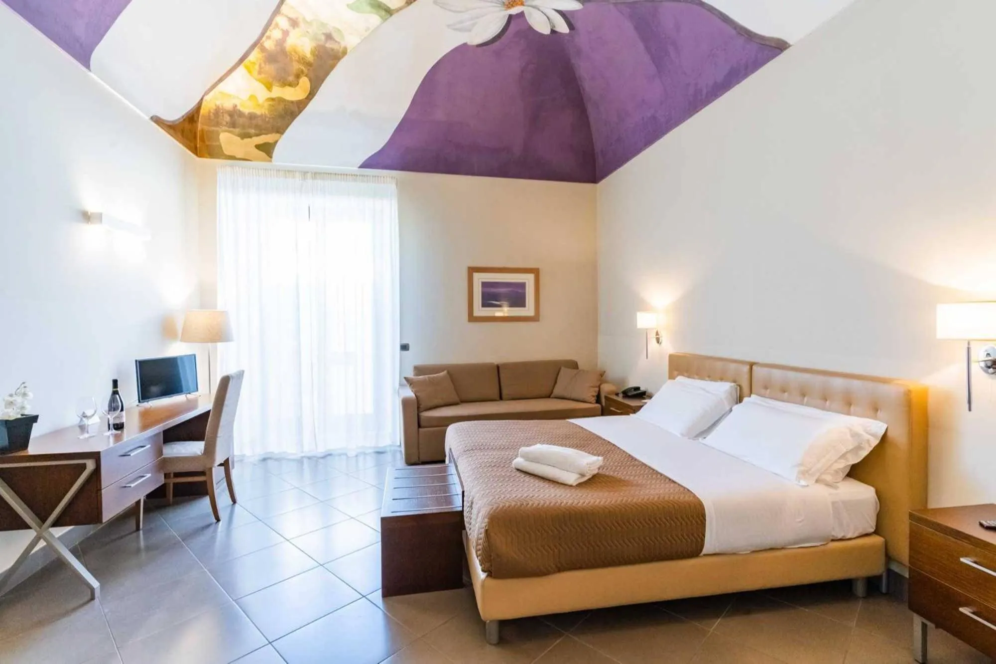 Bed in Le Magnolie Hotel