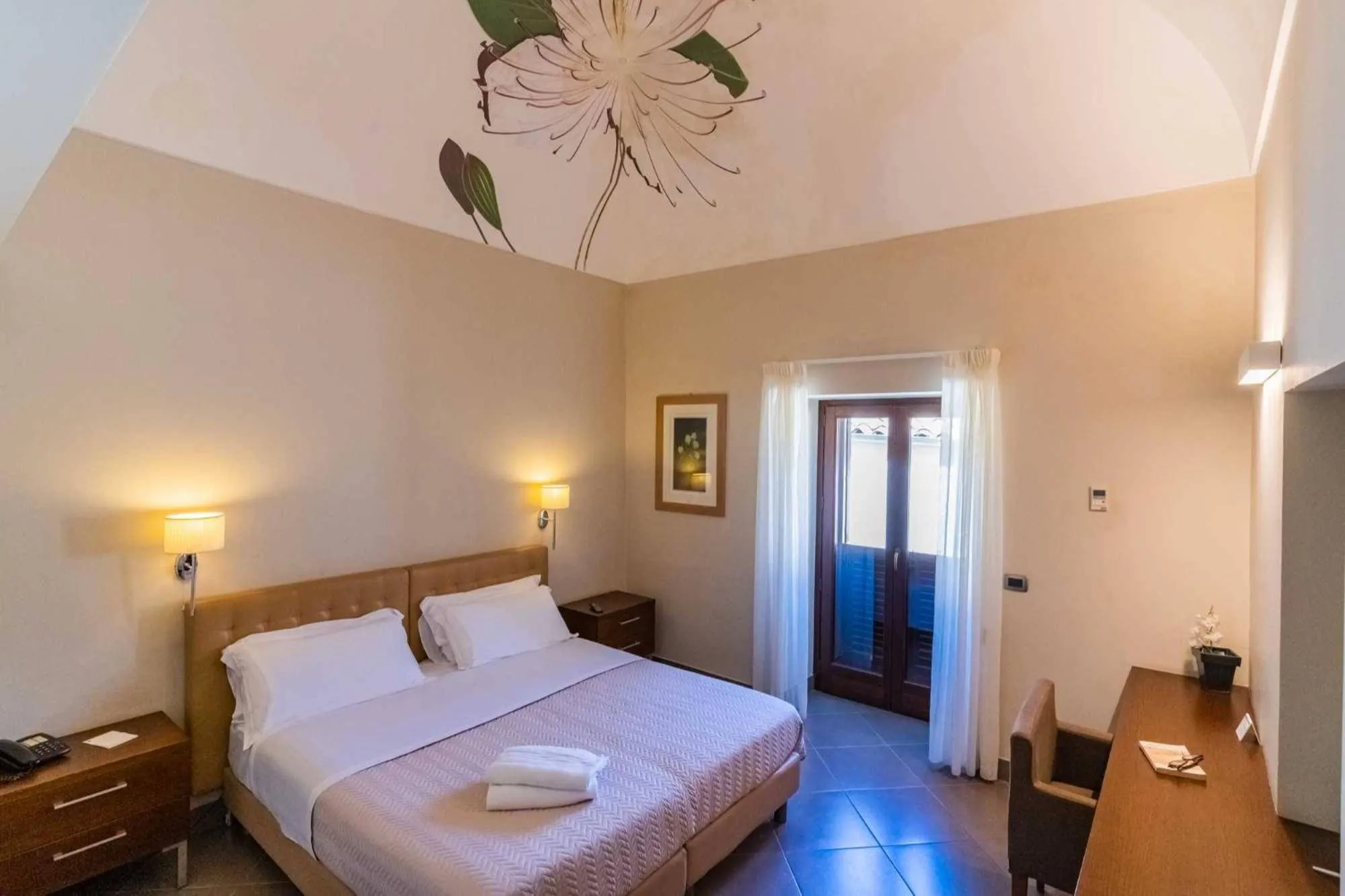 Bed in Le Magnolie Hotel