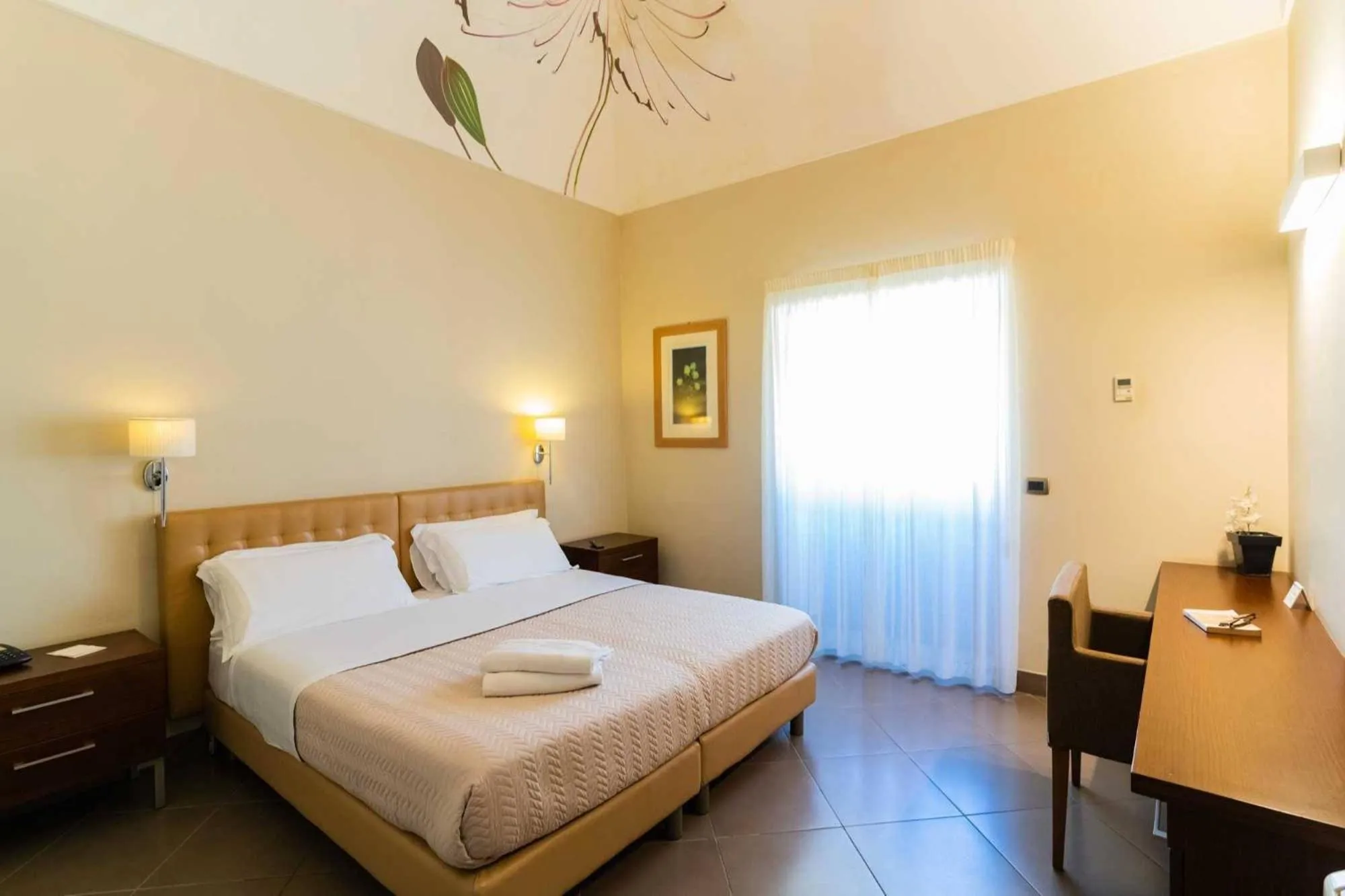 Bed in Le Magnolie Hotel