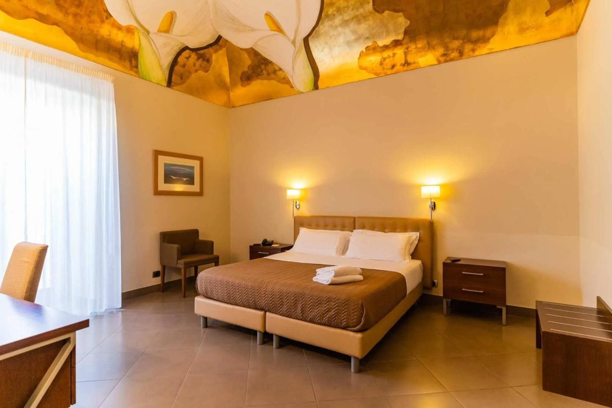 Bed in Le Magnolie Hotel