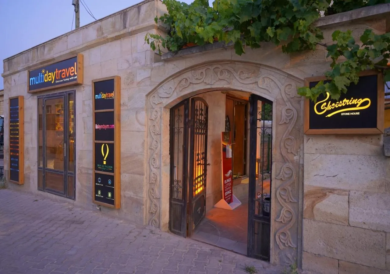 Facade/entrance in ShoeString Stone House