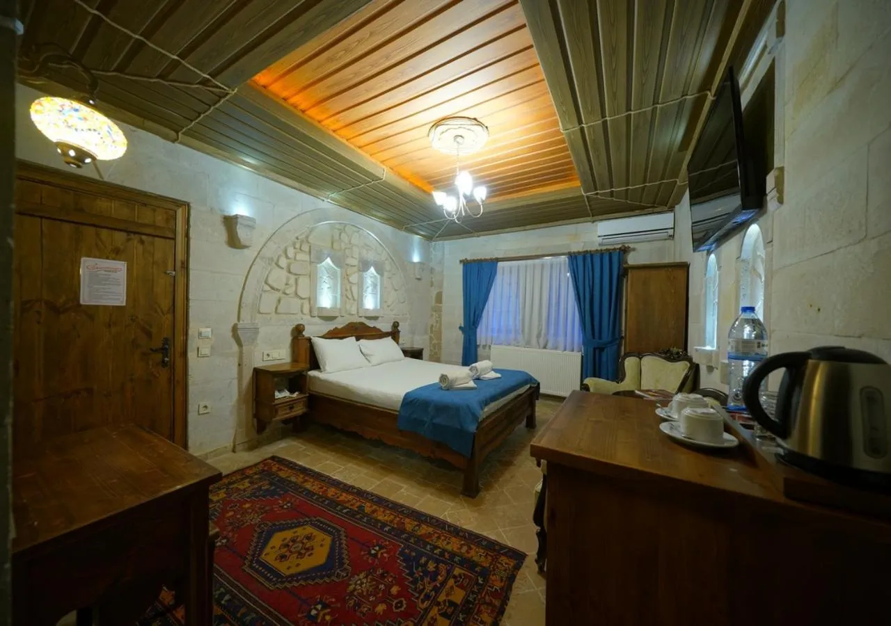 Bed in ShoeString Stone House