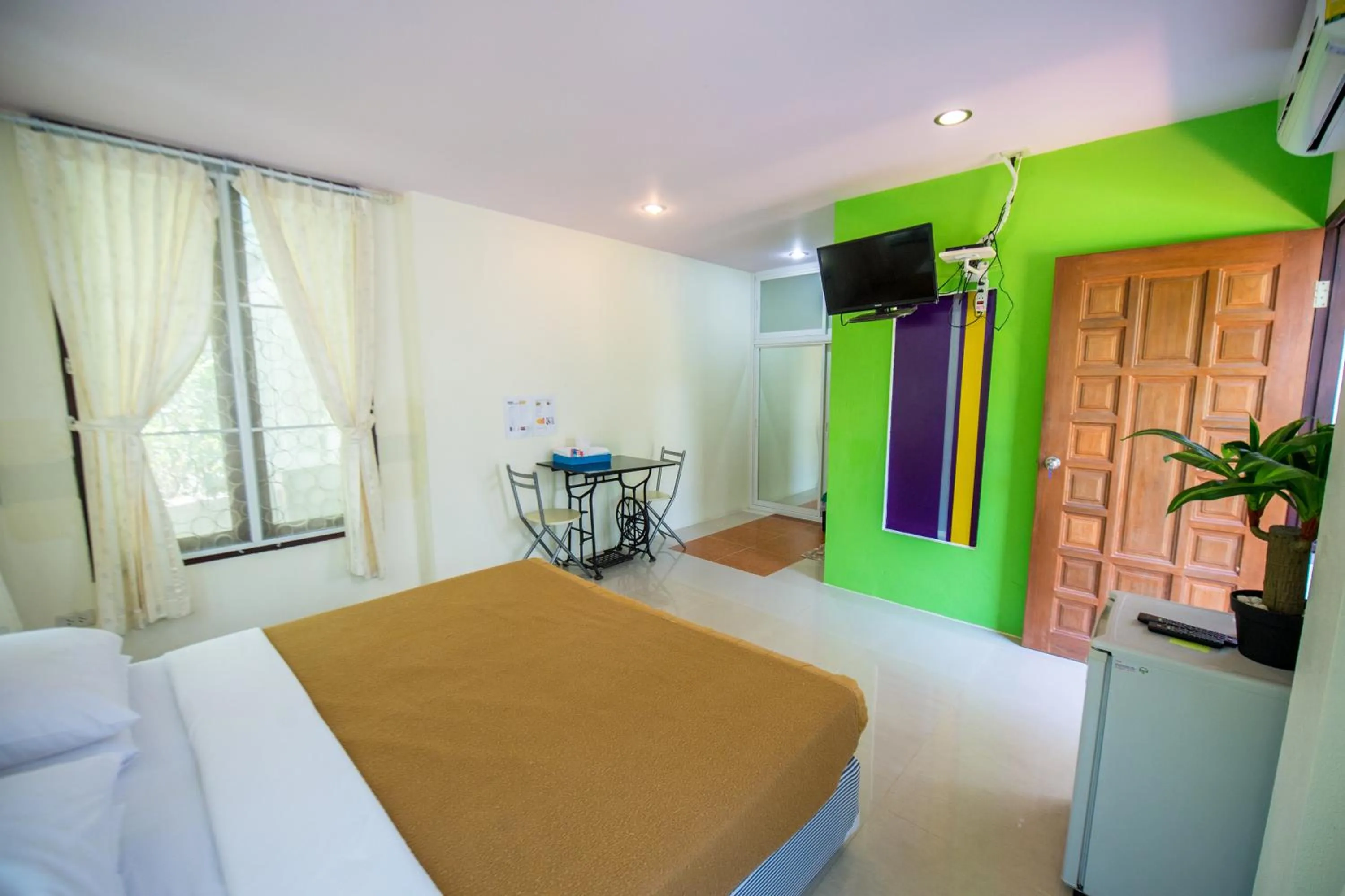 Bed in Poomvarin Resort