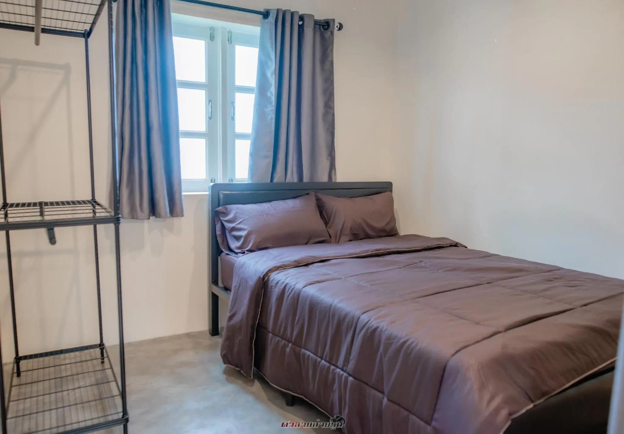 Bed in Poomvarin Resort