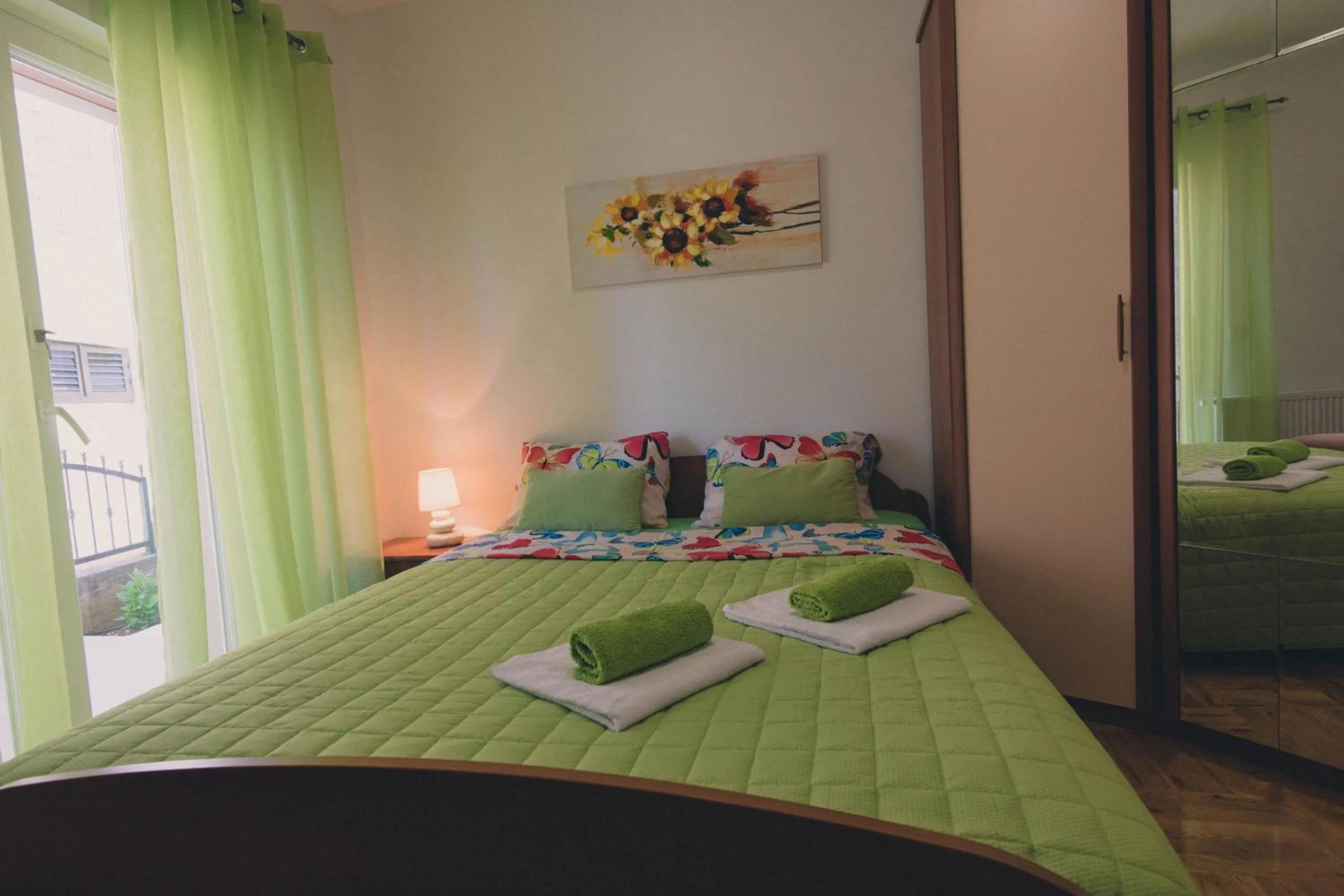 Bedroom, Bed in Apartments Sunny Garden