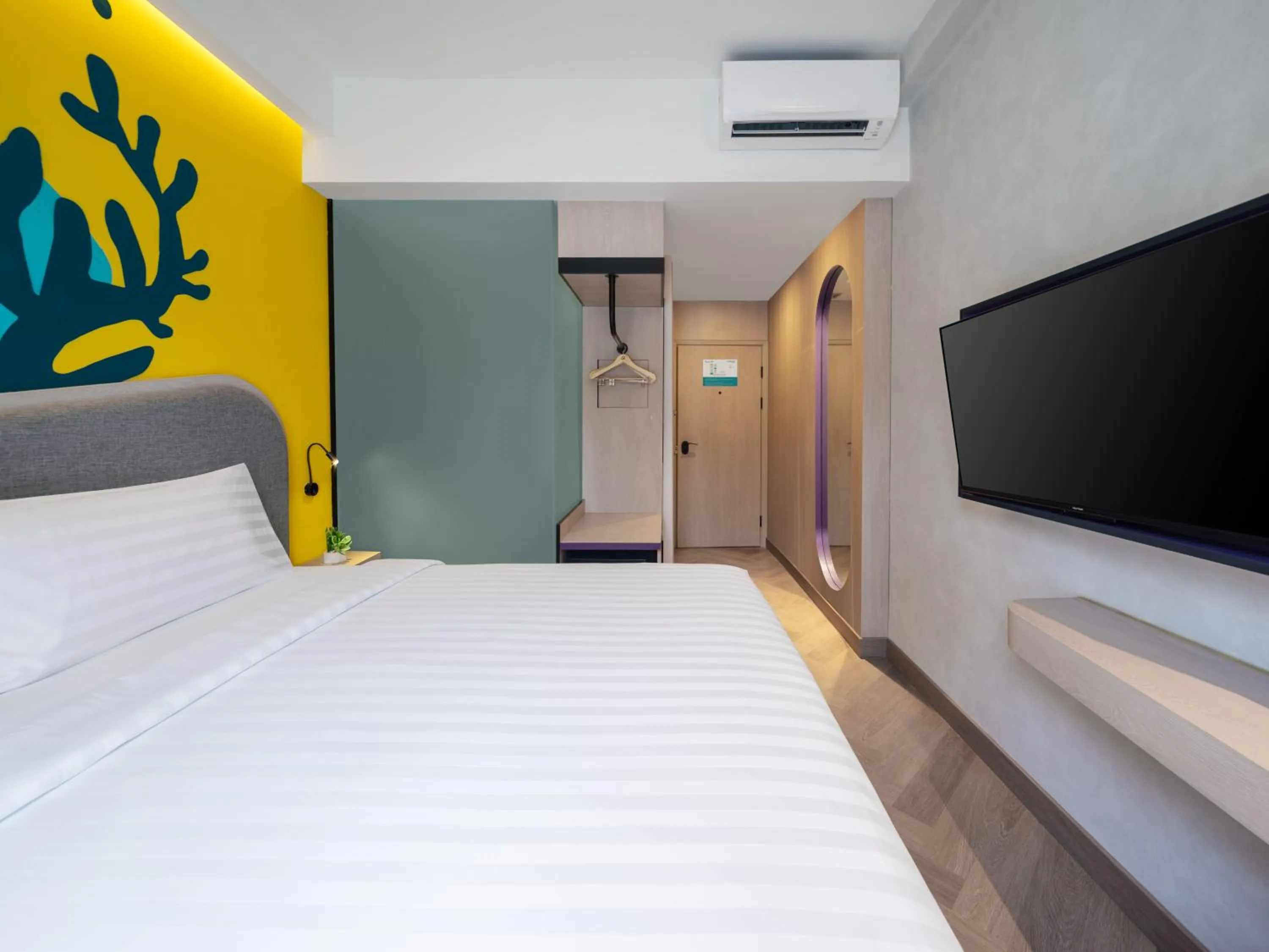 Bed in Quest Vibe Dewi Sri Bali