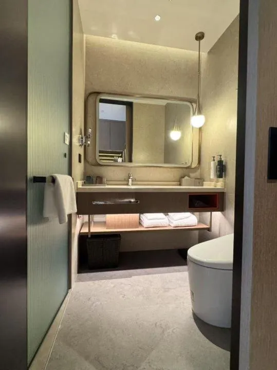 Bathroom in Home2 Suite by Hilton Nantong Vientiane City