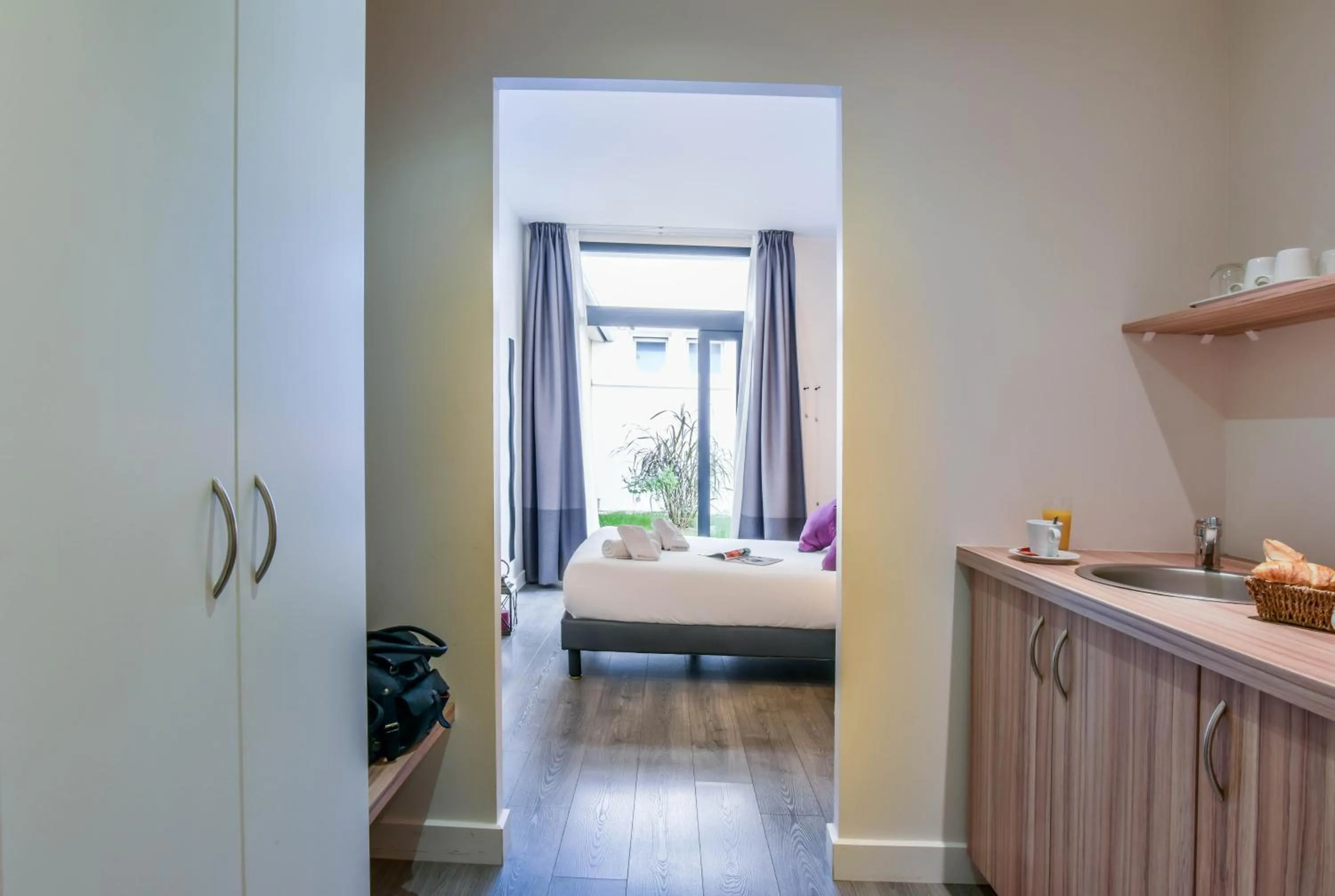 Bed in Logis Hôtels Gnàc é Pause