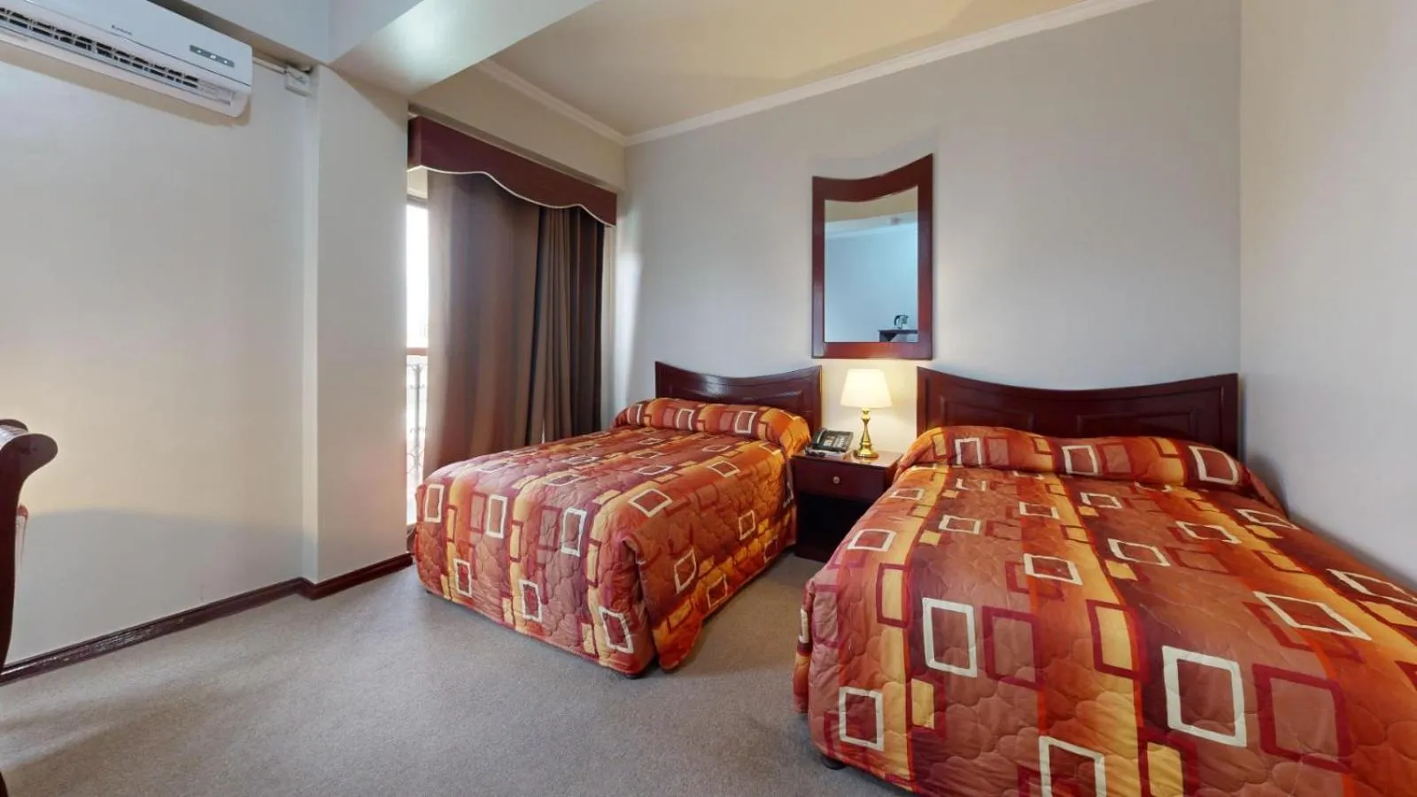 Bed in Regency Suites Hotel